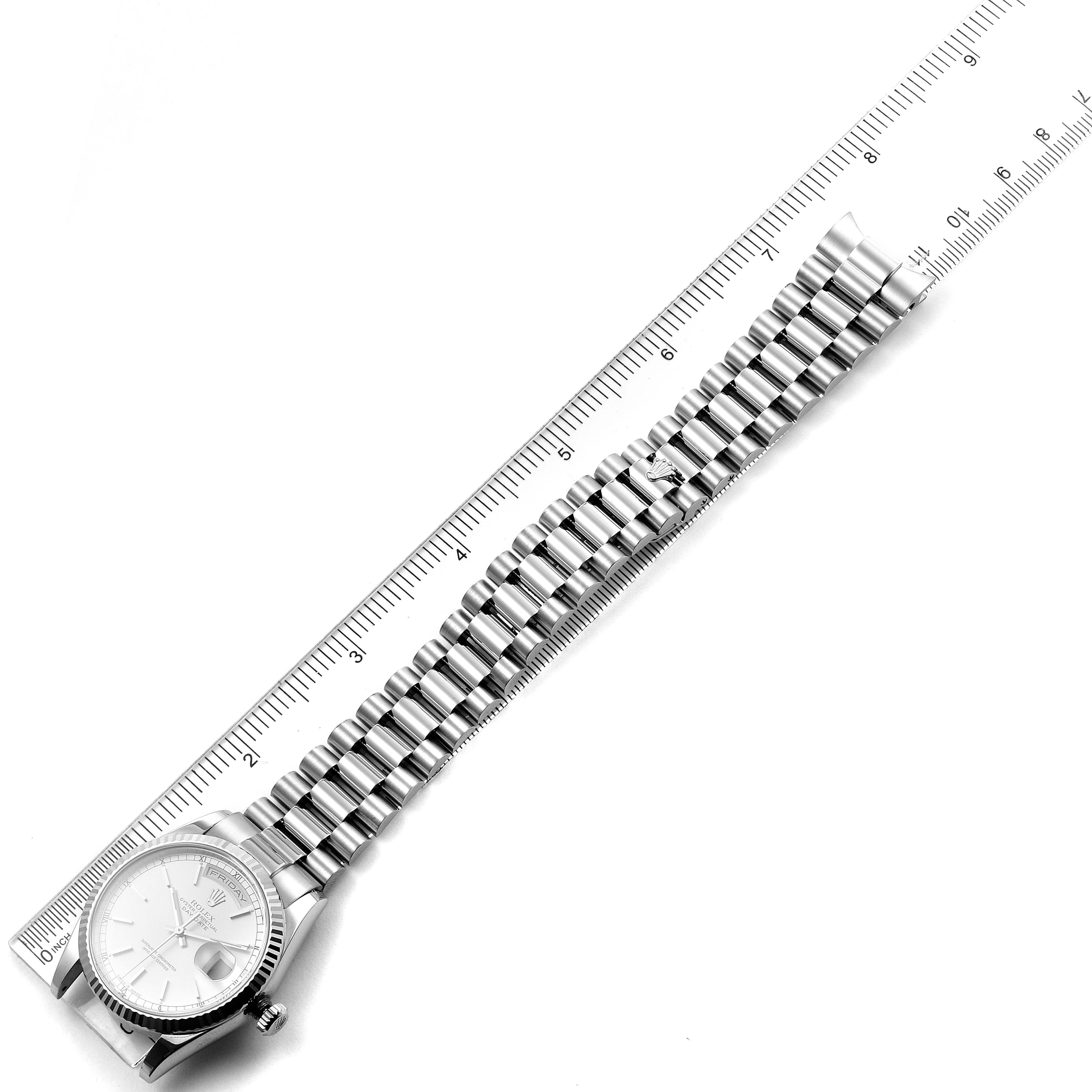 The image shows a Rolex President 118239 Men's White Gold Silver Dial 118239 Men's White Gold Silver Dial model watch laid flat, displaying the face and full bracelet against a ruler for scale.