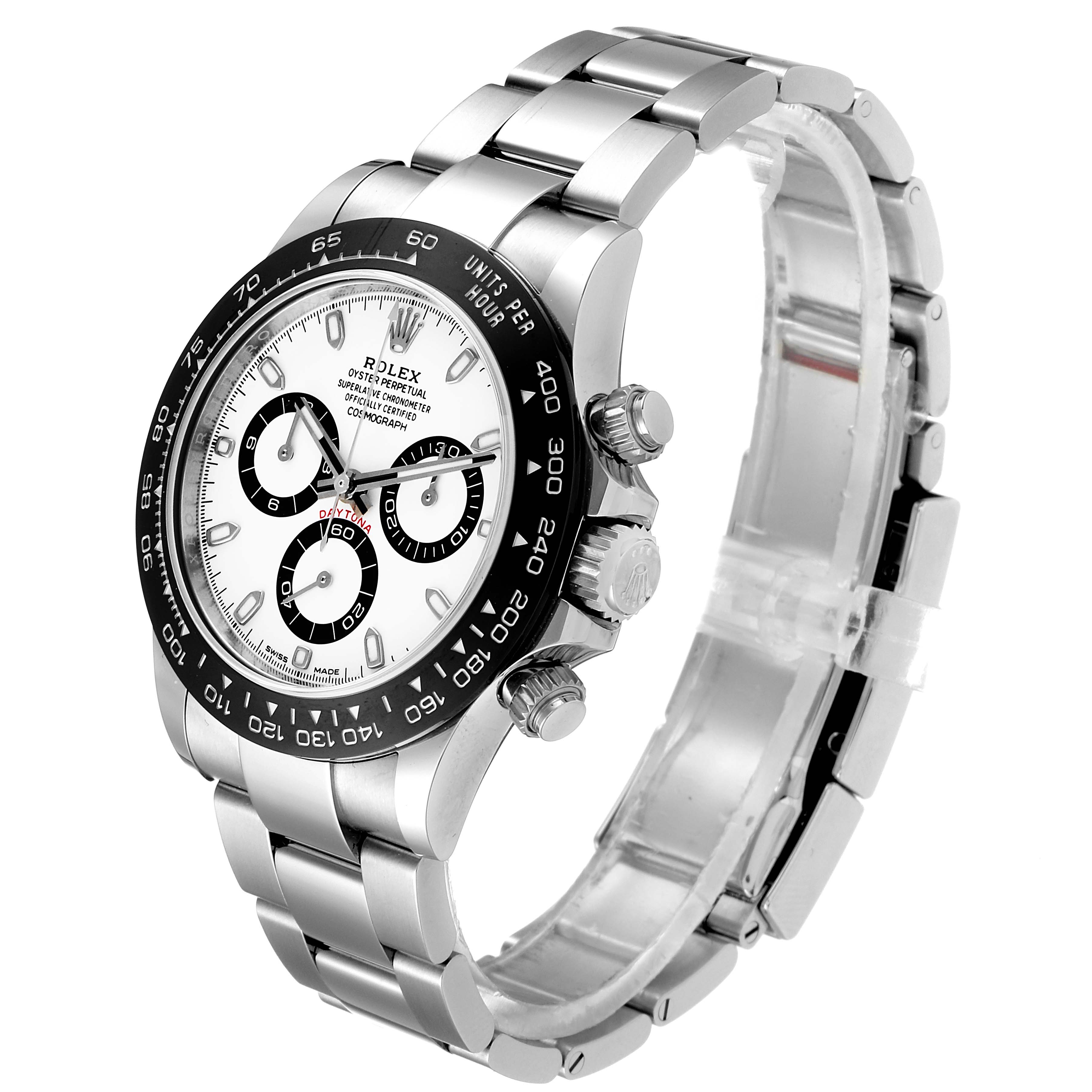 The image shows a side and front angle of a Rolex Daytona 116500 Men's Stainless Steel White Dial 116500 Men's Stainless Steel White Dial watch, highlighting the face, bezel, and bracelet.