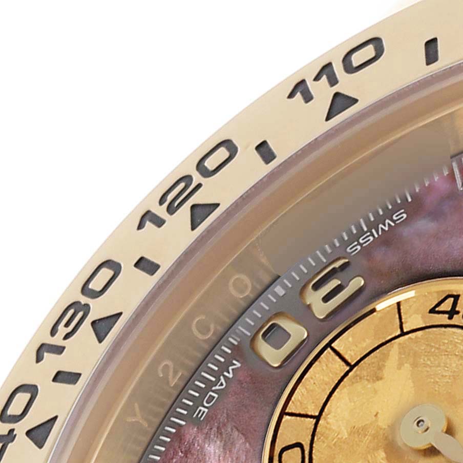 The image shows a close-up of the bezel and part of the dial of a Rolex Daytona 116508 Men's Yellow Gold Mother of Pearl Dial 116508 Men's Yellow Gold Mother of Pearl Dial, highlighting the tachymetric scale.
