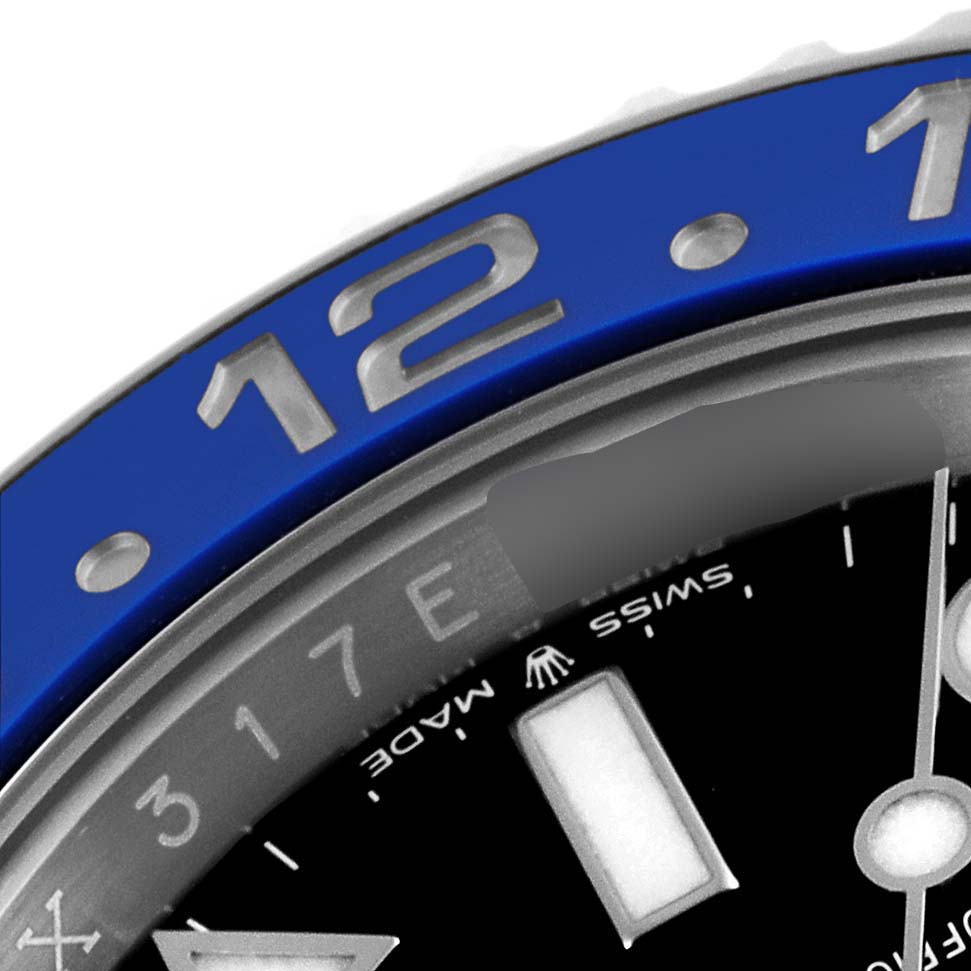 This close-up image of a Rolex GMT-Master 126710 Men
s Stainless Steel Black Dial 126710 Men
s Stainless Steel Black Dial shows part of the bezel, dial, and the Rolex crown logo.