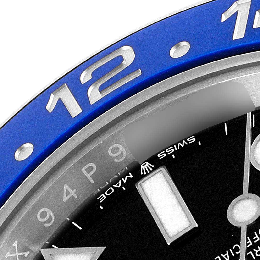 This image shows a close-up of the bezel, dial, and markers of a Rolex GMT-Master 126710 Men's Stainless Steel Black Dial 126710 Men's Stainless Steel Black Dial watch.