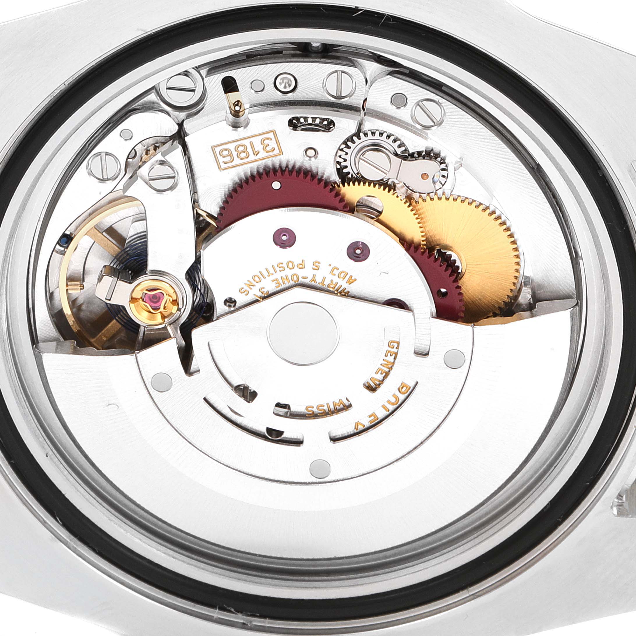 This image shows the inner mechanism of a Rolex GMT-Master 116710 Men's Stainless Steel Black Dial 116710 Men's Stainless Steel Black Dial watch at a close-up angle, highlighting its gears and movement.