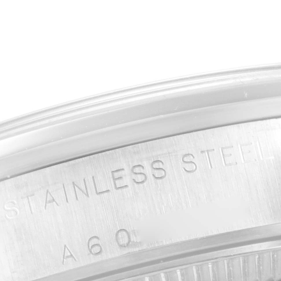 This image shows a close-up of the stainless steel case back of a Mid-Size Rolex watch.