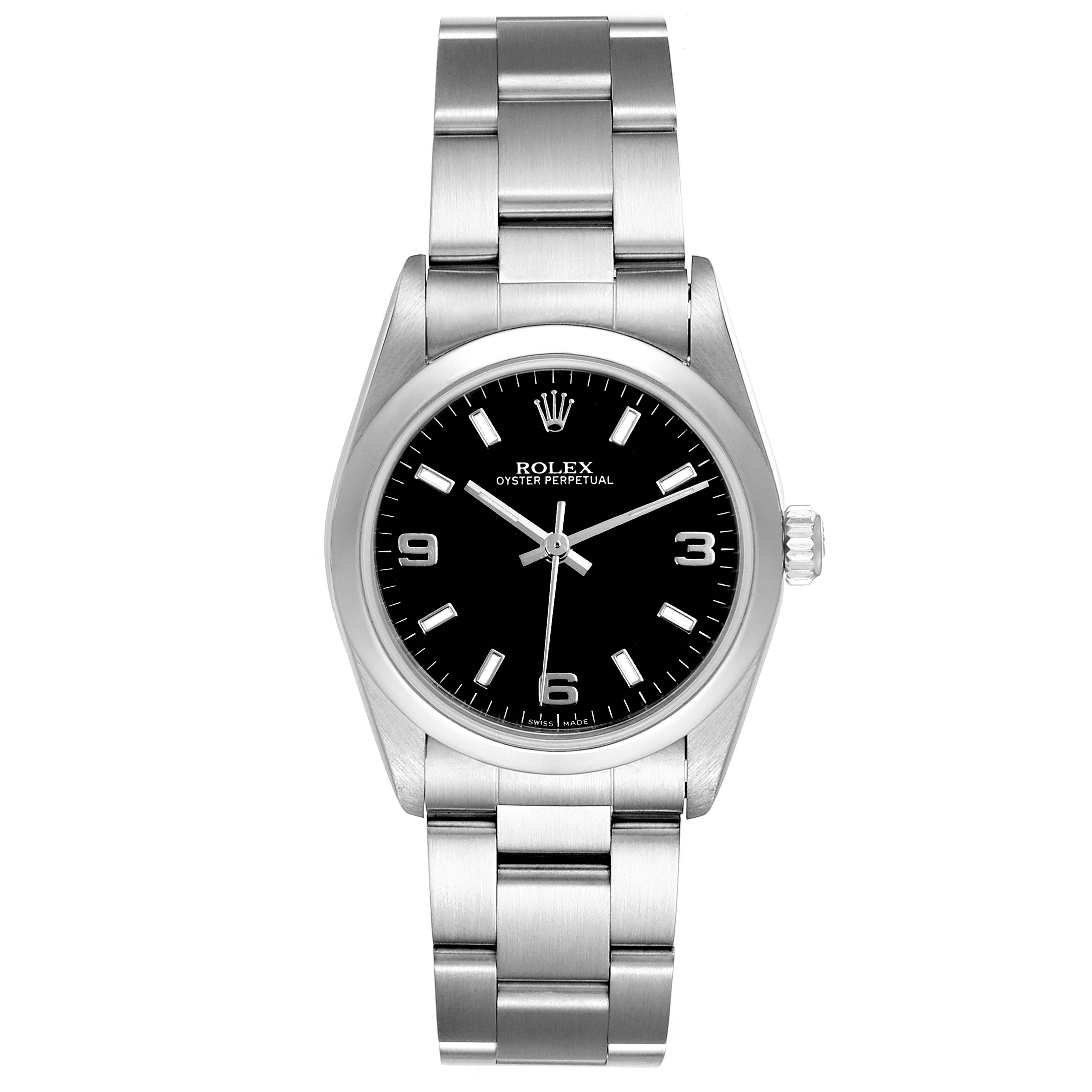 The Rolex Mid-Size 77080 Women's Stainless Steel Black Dial 77080 Women's Stainless Steel Black Dial watch is shown from a front angle, displaying the black dial, hands, hour markers, and metal bracelet.