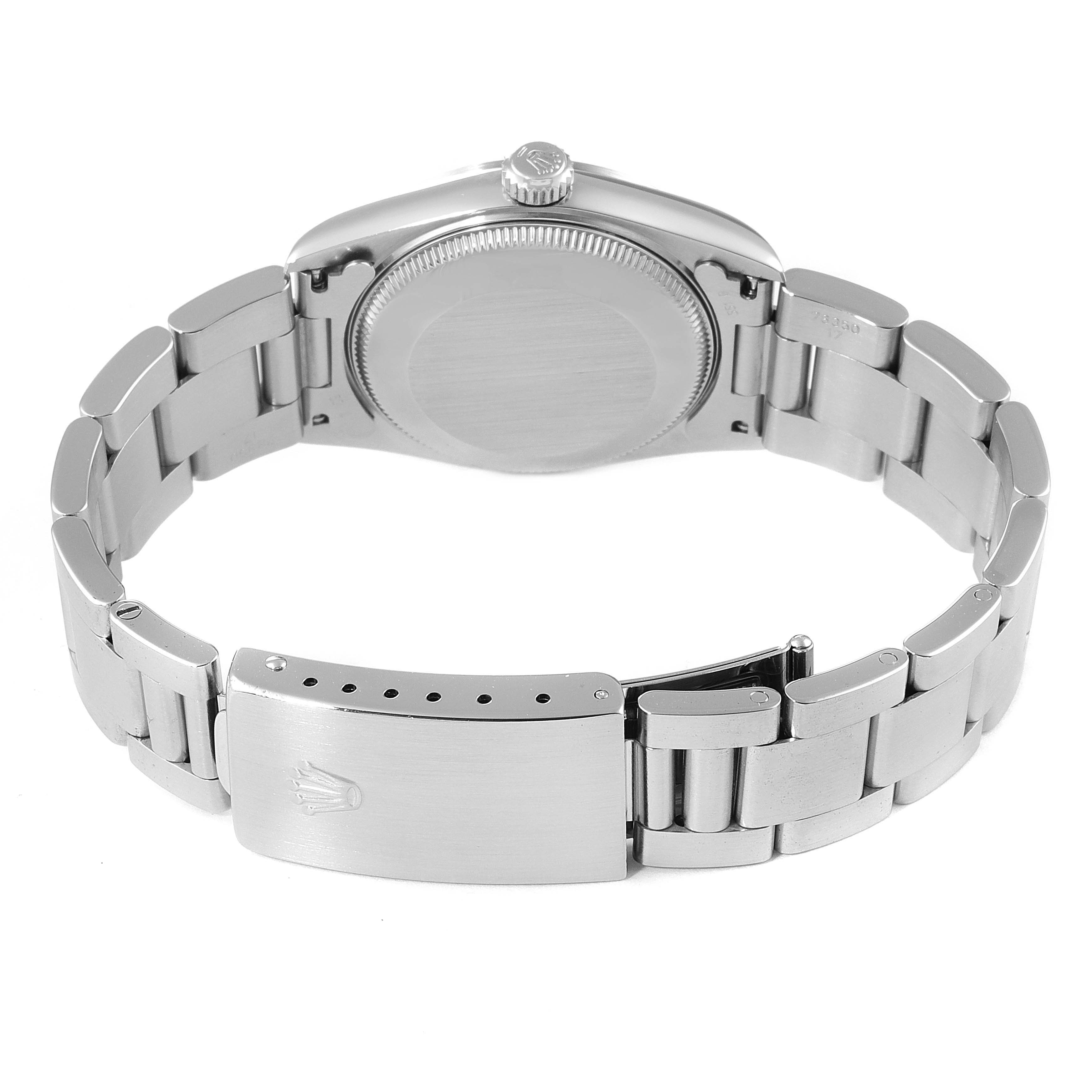 The image shows the back side of a Mid-Size Rolex watch focusing on the case back and bracelet clasp.