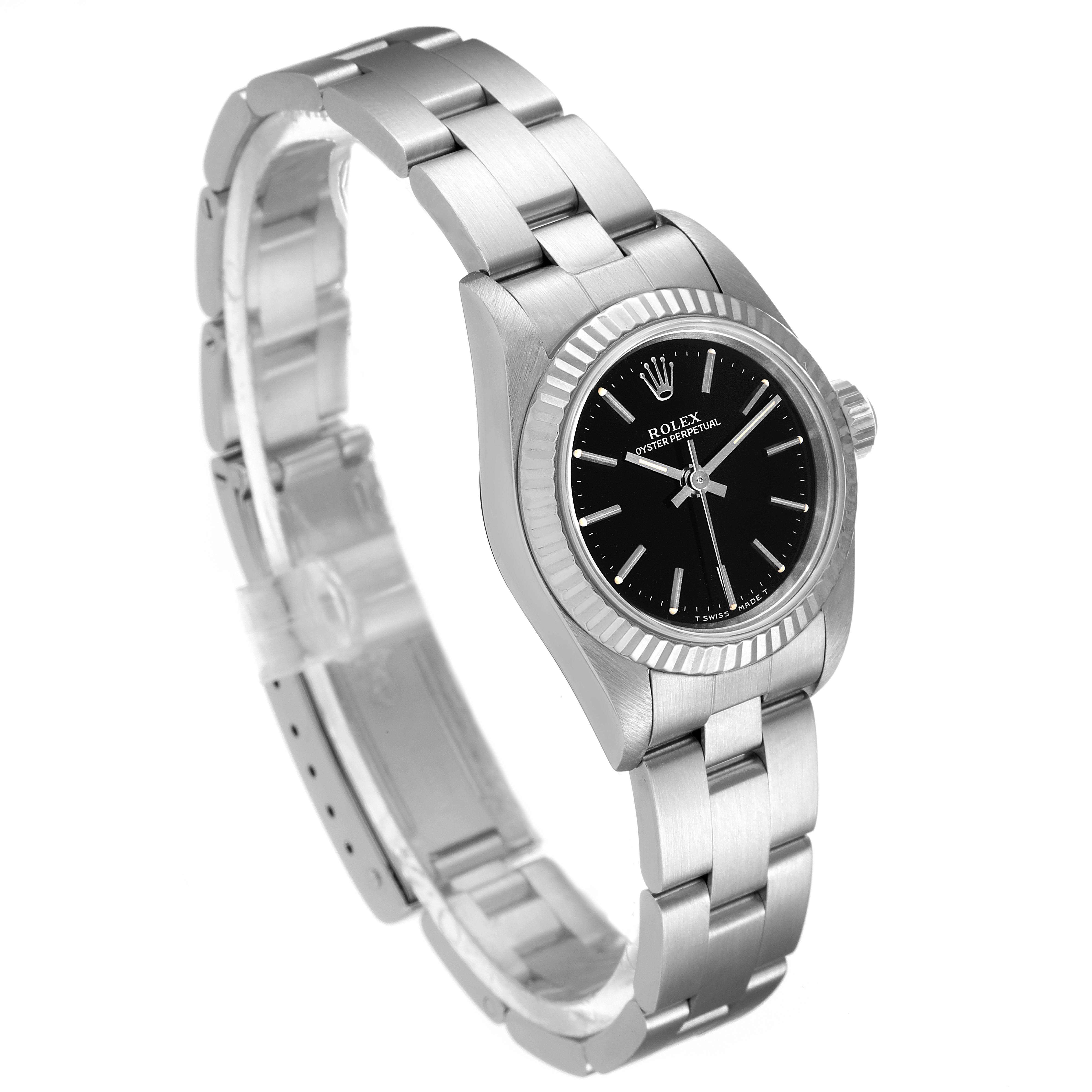 This image shows the Rolex Oyster Perpetual 67194 Women's Stainless Steel Black Dial 67194 Women's Stainless Steel Black Dial watch from a slight side angle, highlighting the watch face, bezel, and metal bracelet.