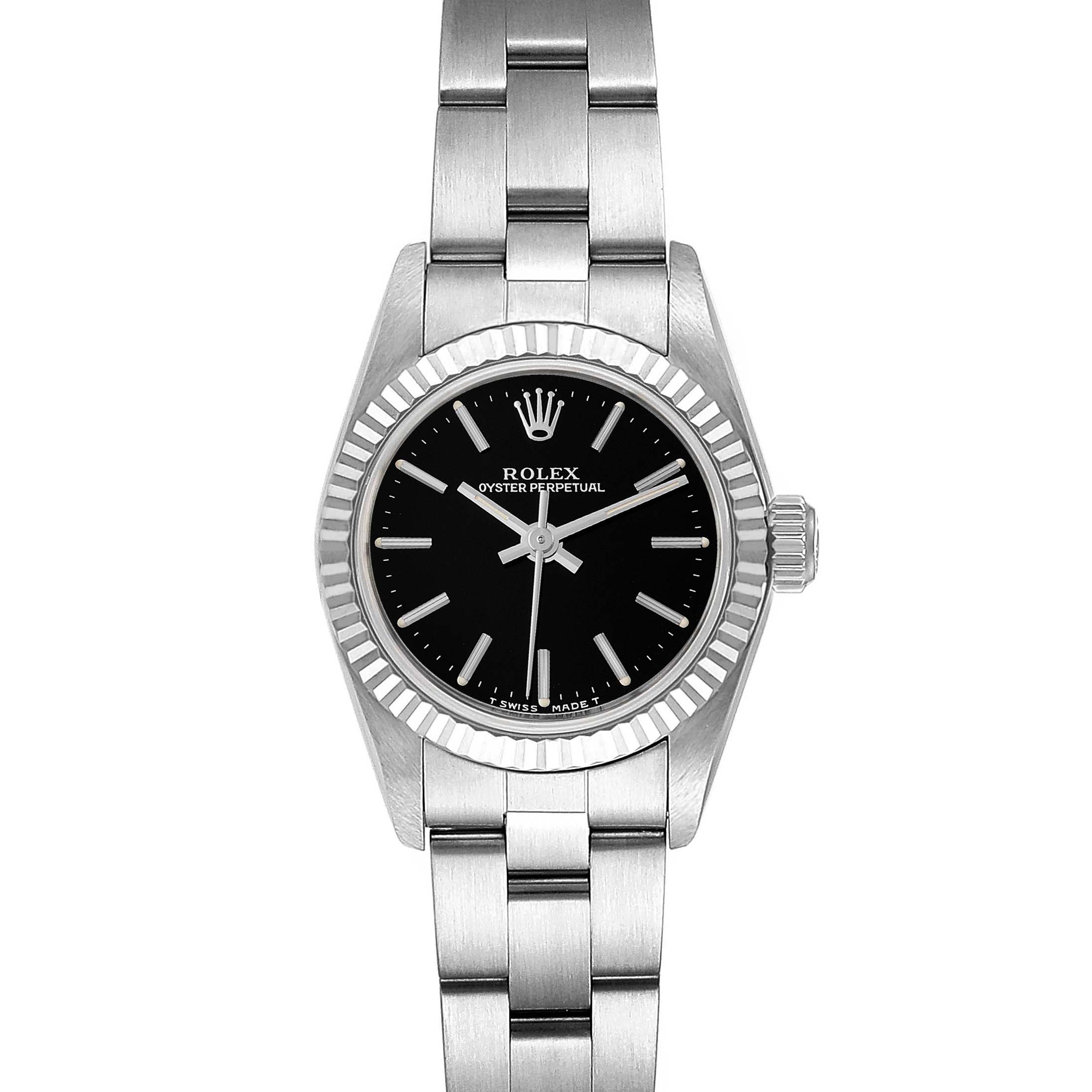 The image shows a front view of a Rolex Oyster Perpetual 67194 Women's Stainless Steel Black Dial 67194 Women's Stainless Steel Black Dial watch, highlighting its black dial, silver bracelet, and fluted bezel.