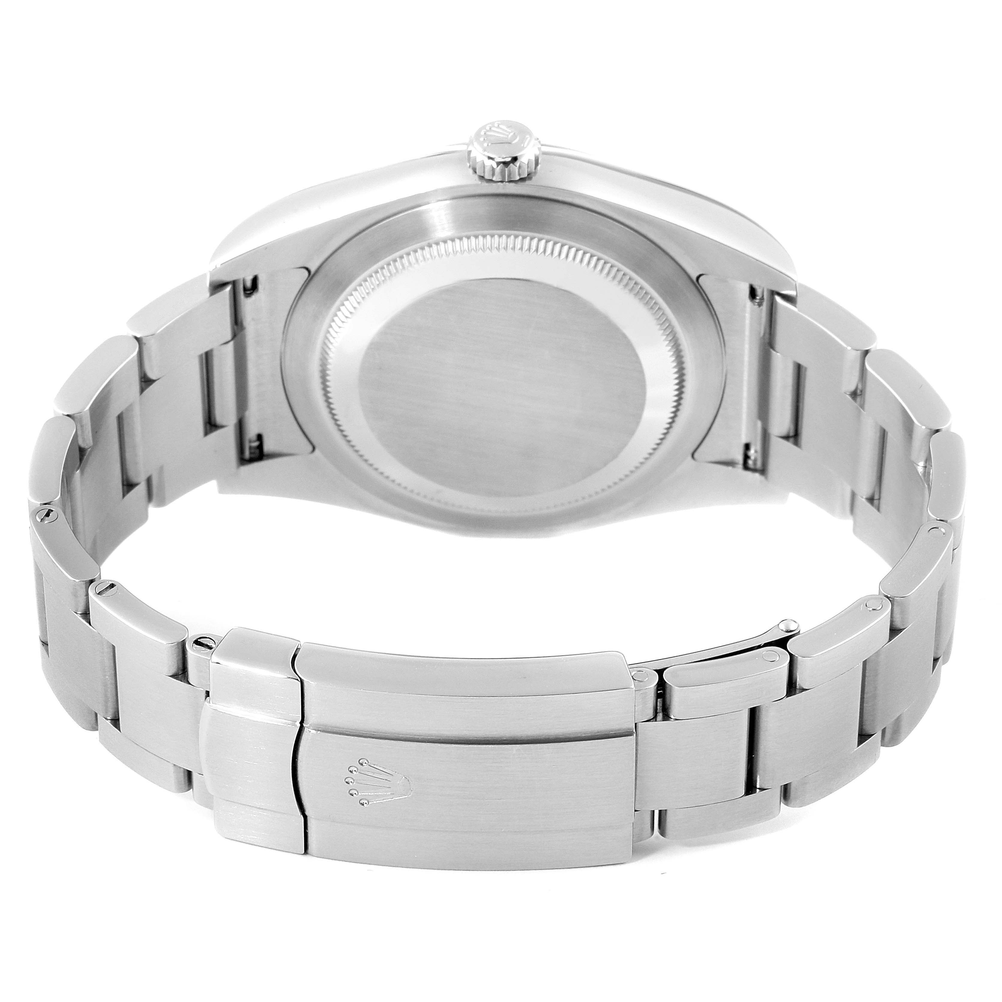 This image shows the back of a Rolex Oyster Perpetual 114300 Men's Stainless Steel Silver Dial 114300 Men's Stainless Steel Silver Dial watch and its stainless steel bracelet with the clasp closed.