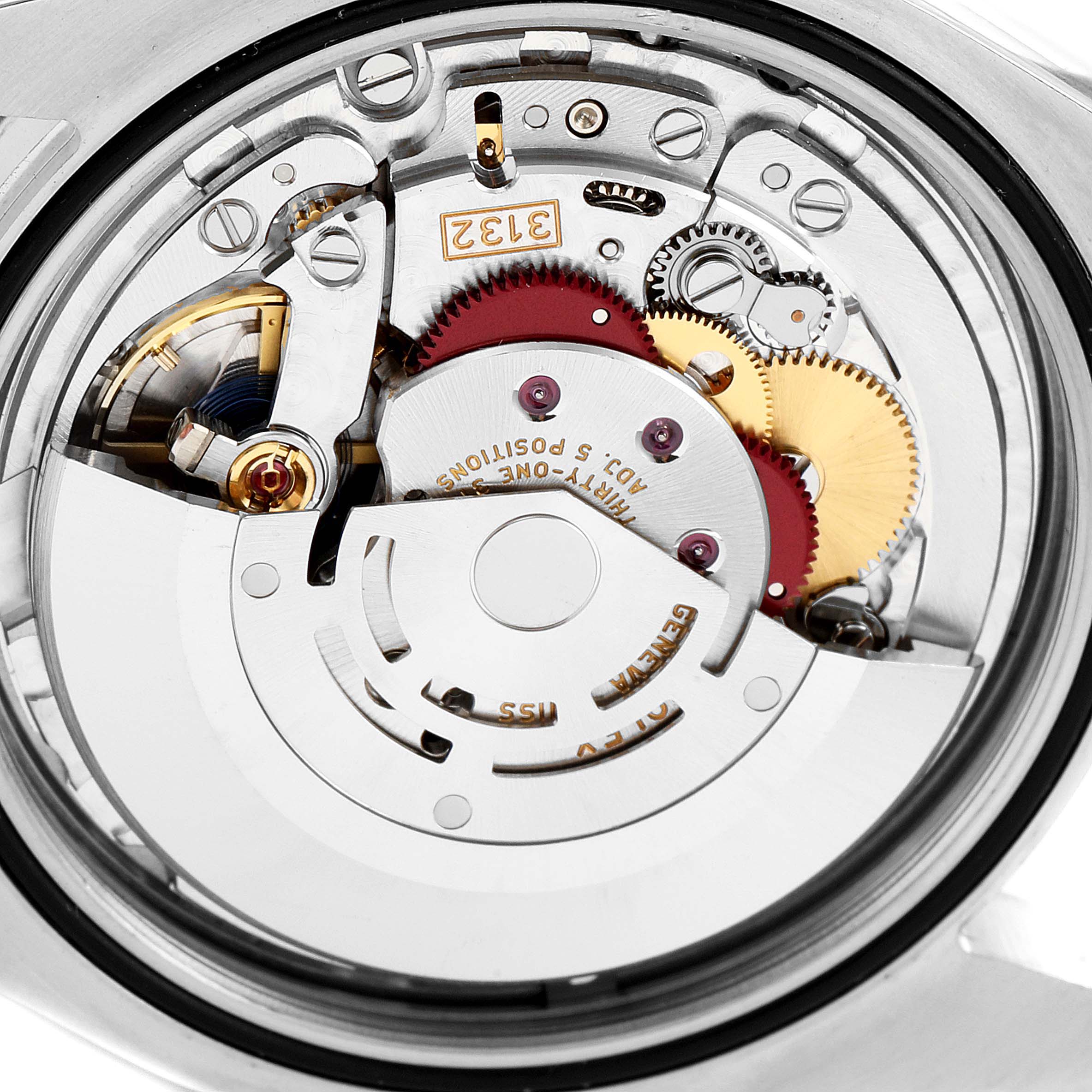 The image shows the internal mechanism of a Rolex Oyster Perpetual 114300 Men's Stainless Steel Silver Dial 114300 Men's Stainless Steel Silver Dial watch from a close-up, top-down angle.