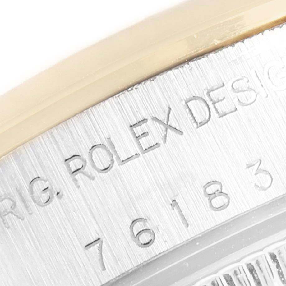 This image shows a close-up of the engraved case back of a Rolex Oyster Perpetual 76183 Women's Steel and Gold (two tone) Grey Dial 76183 Women's Steel and Gold (two tone) Grey Dial watch, highlighting the model number.