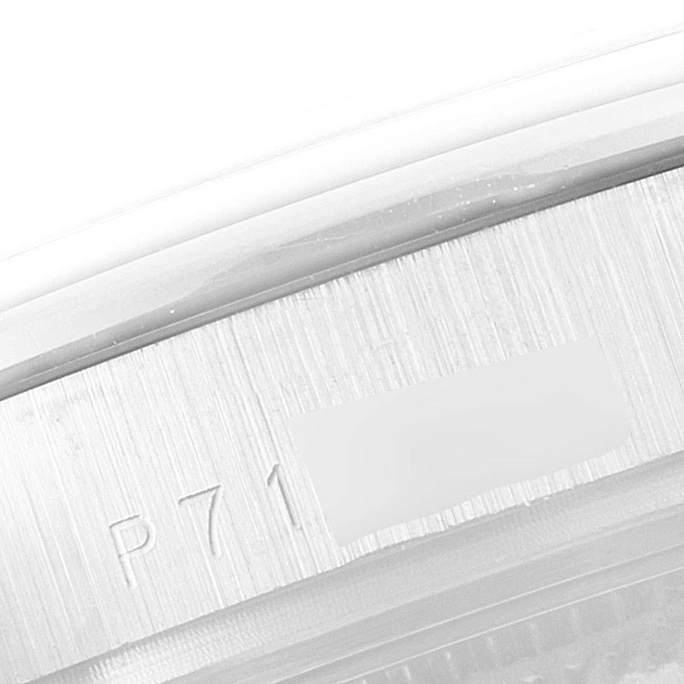 The image shows a close-up of the serial number engraved on the case of a Rolex Pearlmaster 81319 Women's White Gold Mother of Pearl Dial 81319 Women's White Gold Mother of Pearl Dial watch.