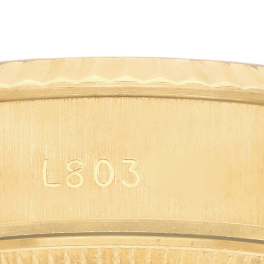 The image shows a close-up of the side, highlighting the serial number on a Rolex President 69178 Women's Yellow Gold Champagne Dial 69178 Women's Yellow Gold Champagne Dial watch.