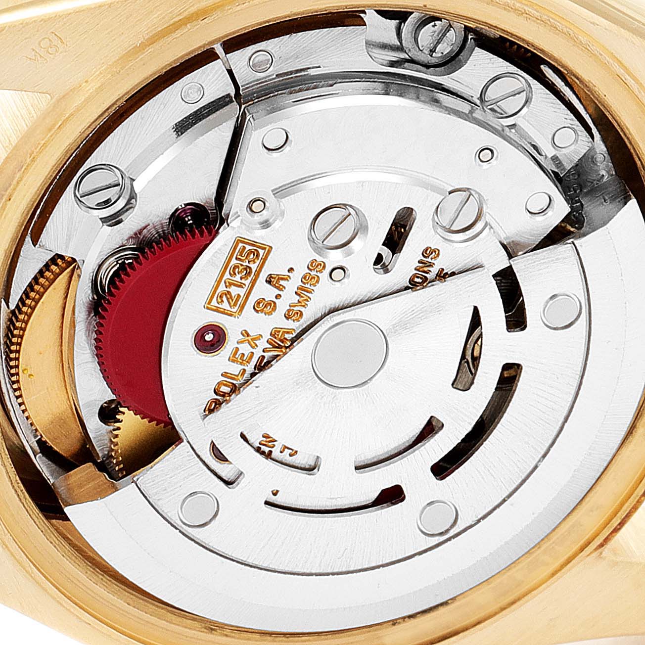 This image shows an internal view of the Rolex President 69178 Women's Yellow Gold Champagne Dial 69178 Women's Yellow Gold Champagne Dial watch model, highlighting its intricate movement and mechanical parts.