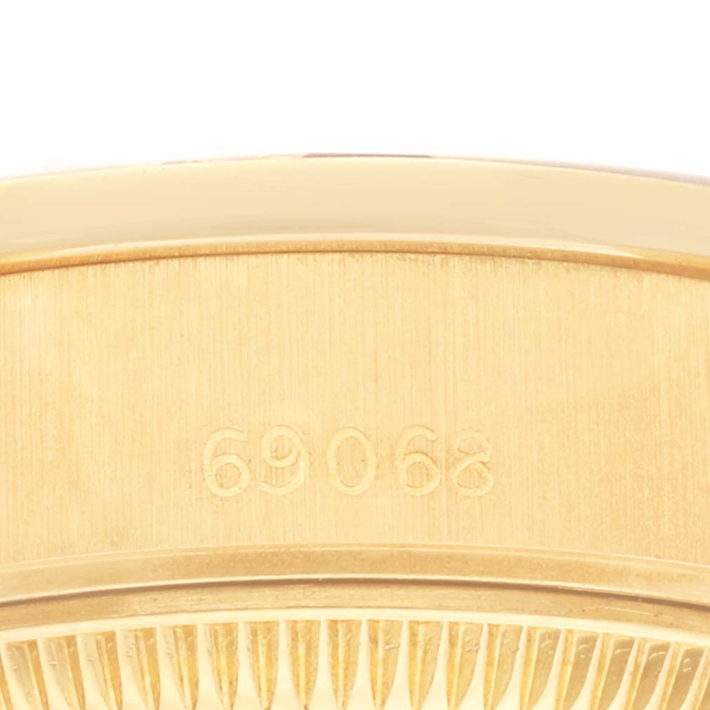The image shows a close-up of the case back edge with the model number 69068 from a Rolex President 69068 Women's Yellow Gold Champagne Dial 69068 Women's Yellow Gold Champagne Dial watch.