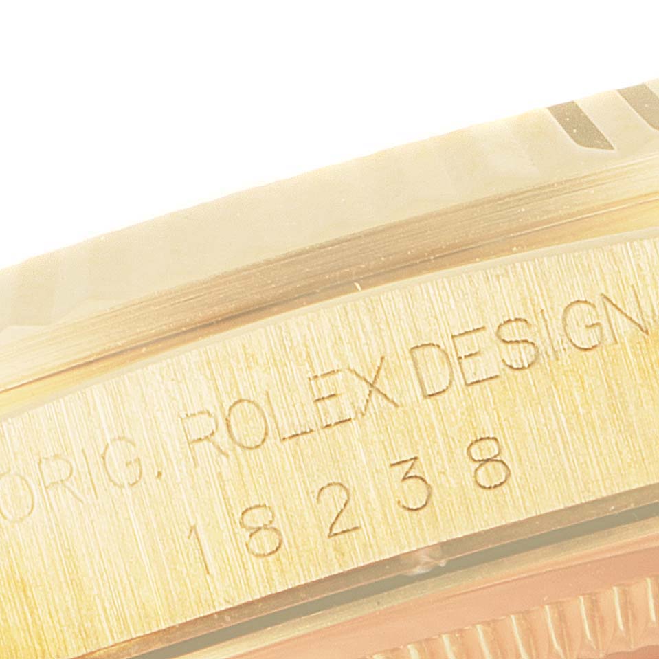 This close-up image shows the engraved model number "18238" and "ORIG. ROLEX DESIGN" on the side of the Rolex President 18238 Men's Yellow Gold Champagne Dial 18238 Men's Yellow Gold Champagne Dial watch case.