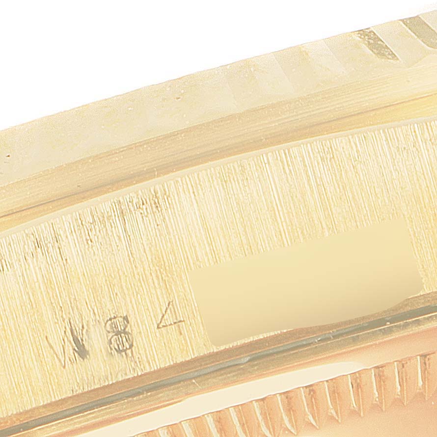 The image shows a close-up of the casing and serial number area of a Rolex President 18238 Men's Yellow Gold Champagne Dial 18238 Men's Yellow Gold Champagne Dial model watch.