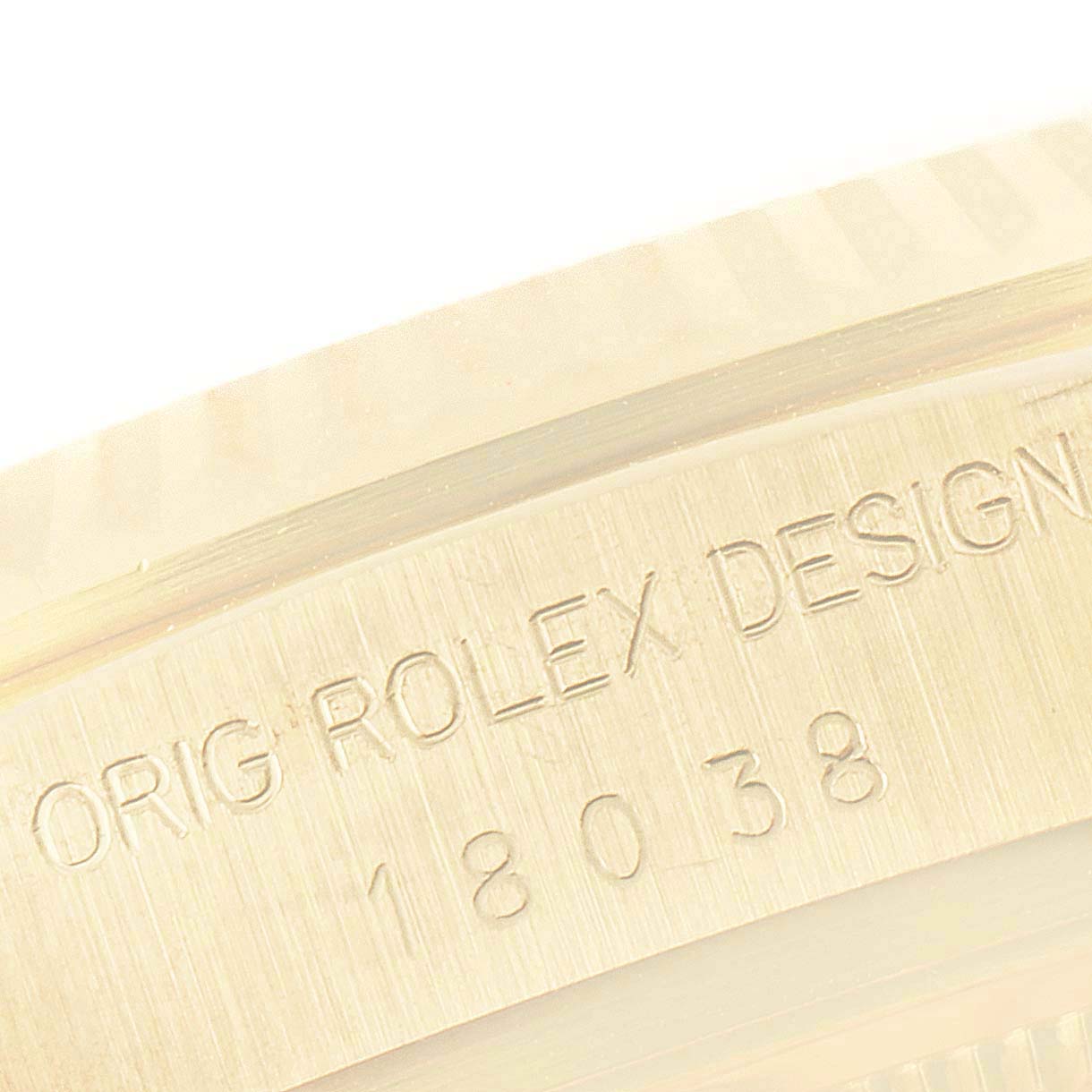 This close-up image shows the engraved model number and branding on the case of a Rolex President 18038 Men's Yellow Gold Silver Dial 18038 Men's Yellow Gold Silver Dial watch.