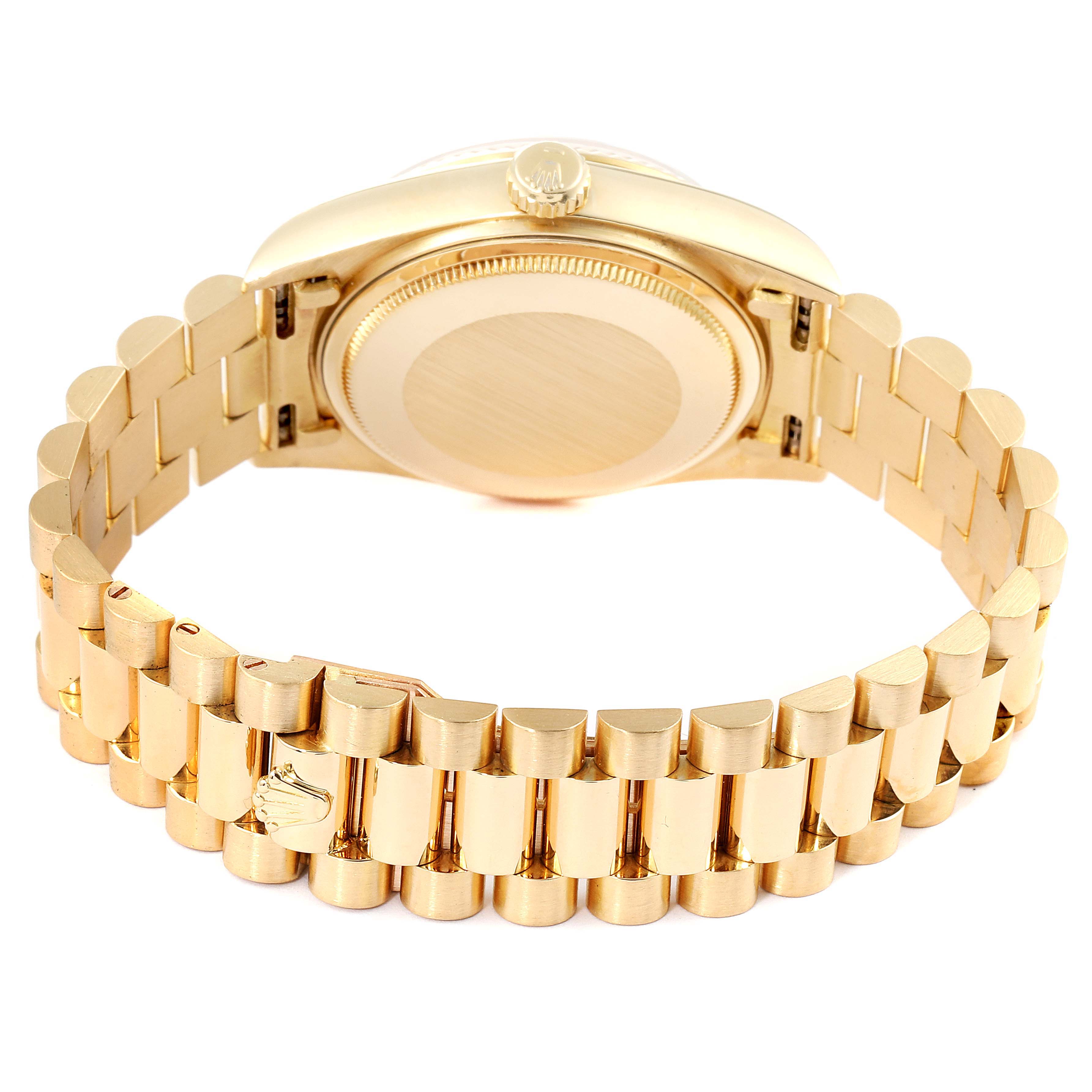 The image shows the back case and gold bracelet of a Rolex President 18038 Men's Yellow Gold Silver Dial 18038 Men's Yellow Gold Silver Dial model watch from an overhead angle.