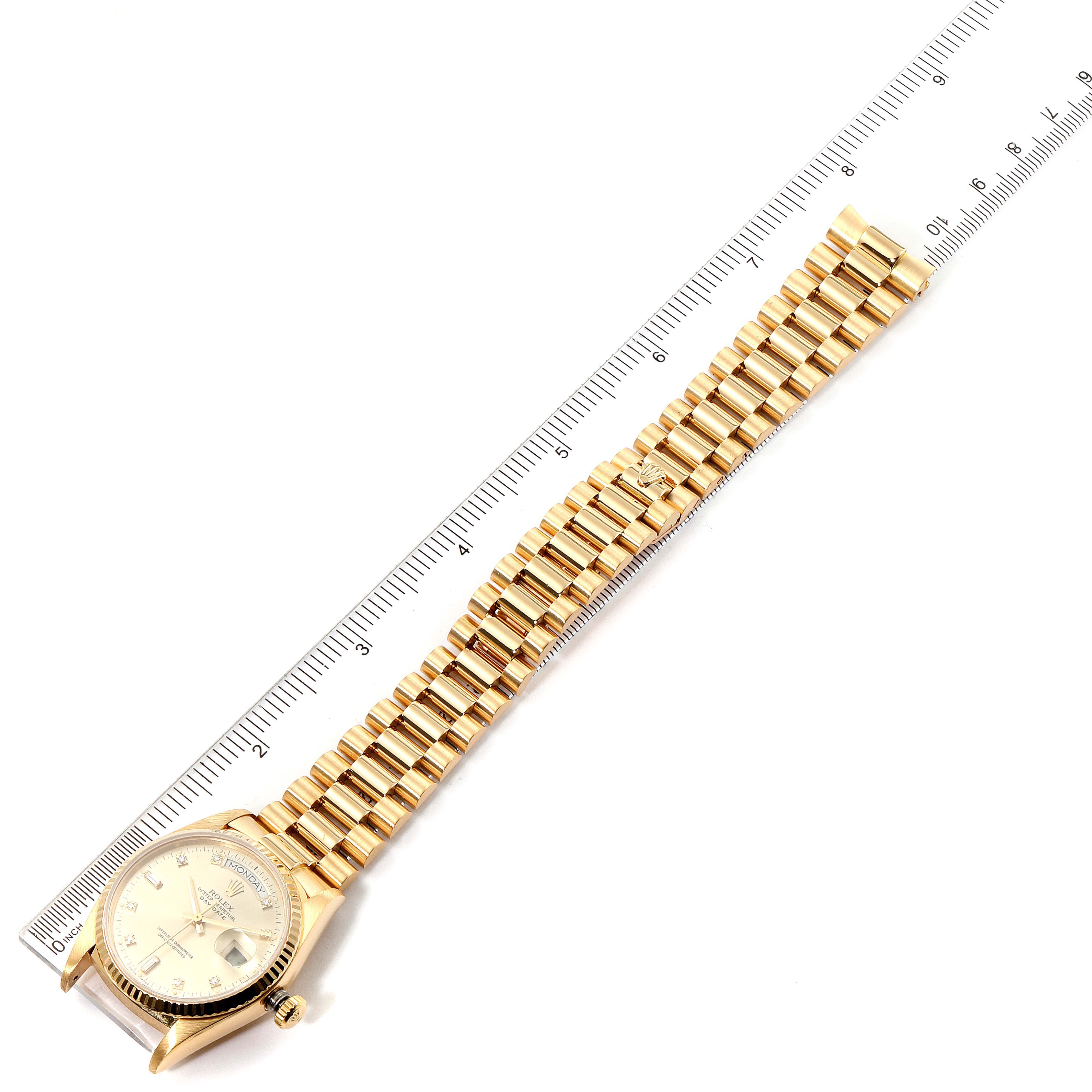 The image shows a Rolex President 18038 Men's Yellow Gold Silver Dial 18038 Men's Yellow Gold Silver Dial watch lying flat with its gold bracelet and face visible, alongside a ruler for scale.