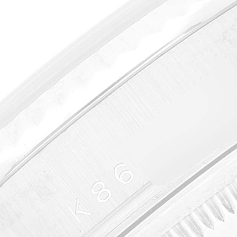 This image shows a close-up view of the case side with engravings of a Rolex President 118239 Men's White Gold Brown Dial 118239 Men's White Gold Brown Dial model watch.