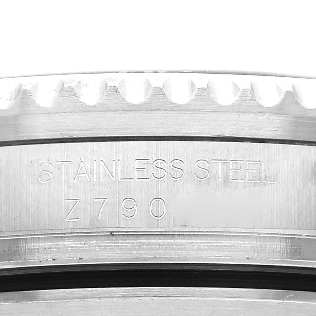 This image shows a close-up of the bezel and engraving on the side of a Rolex Sea-Dweller 16600T Men's Stainless Steel Black Dial 16600T Men's Stainless Steel Black Dial watch case.