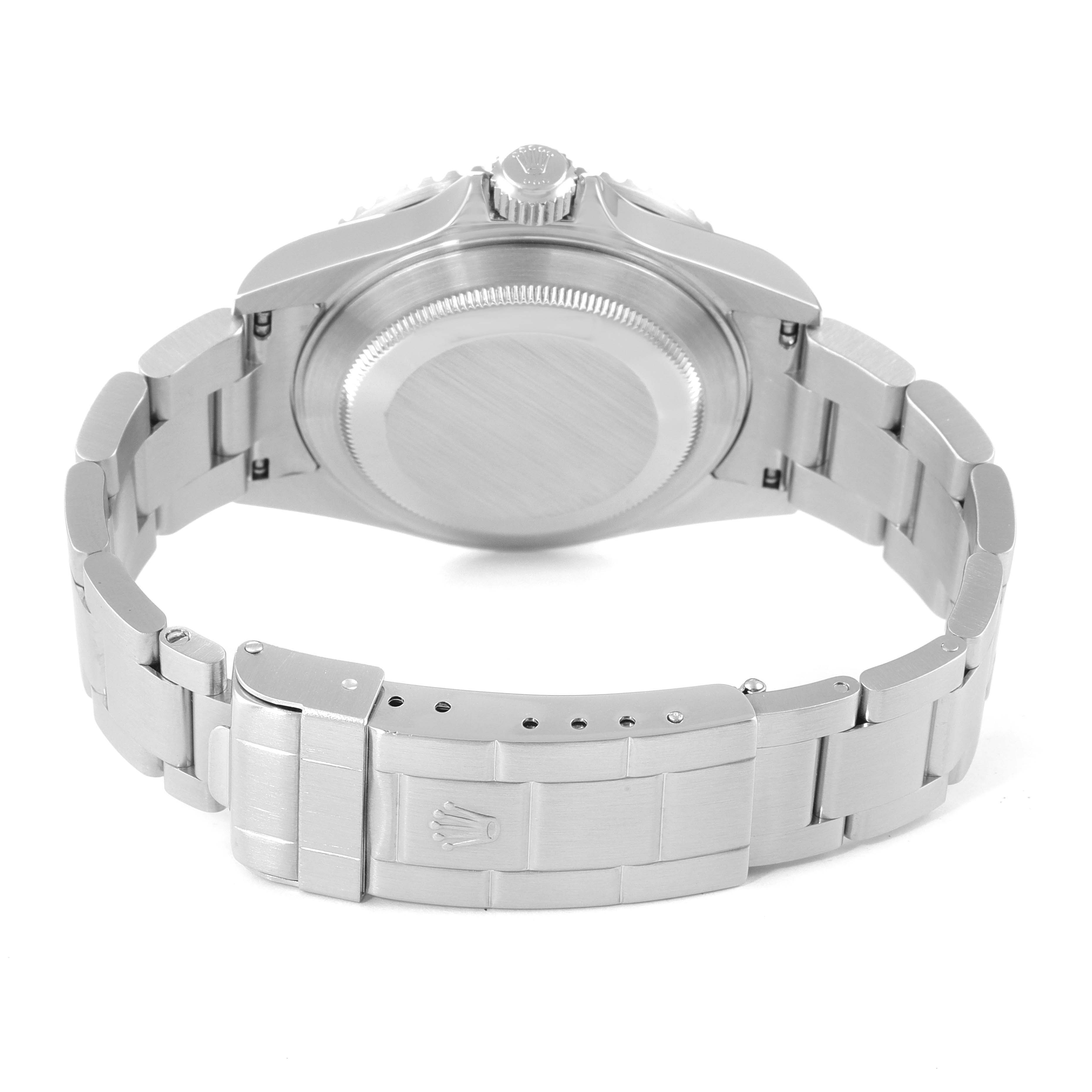 The image shows the back of a Rolex Submariner 16610 Men's Stainless Steel Black Dial 16610 Men's Stainless Steel Black Dial watch, focusing on the case back, bracelet, and clasp.