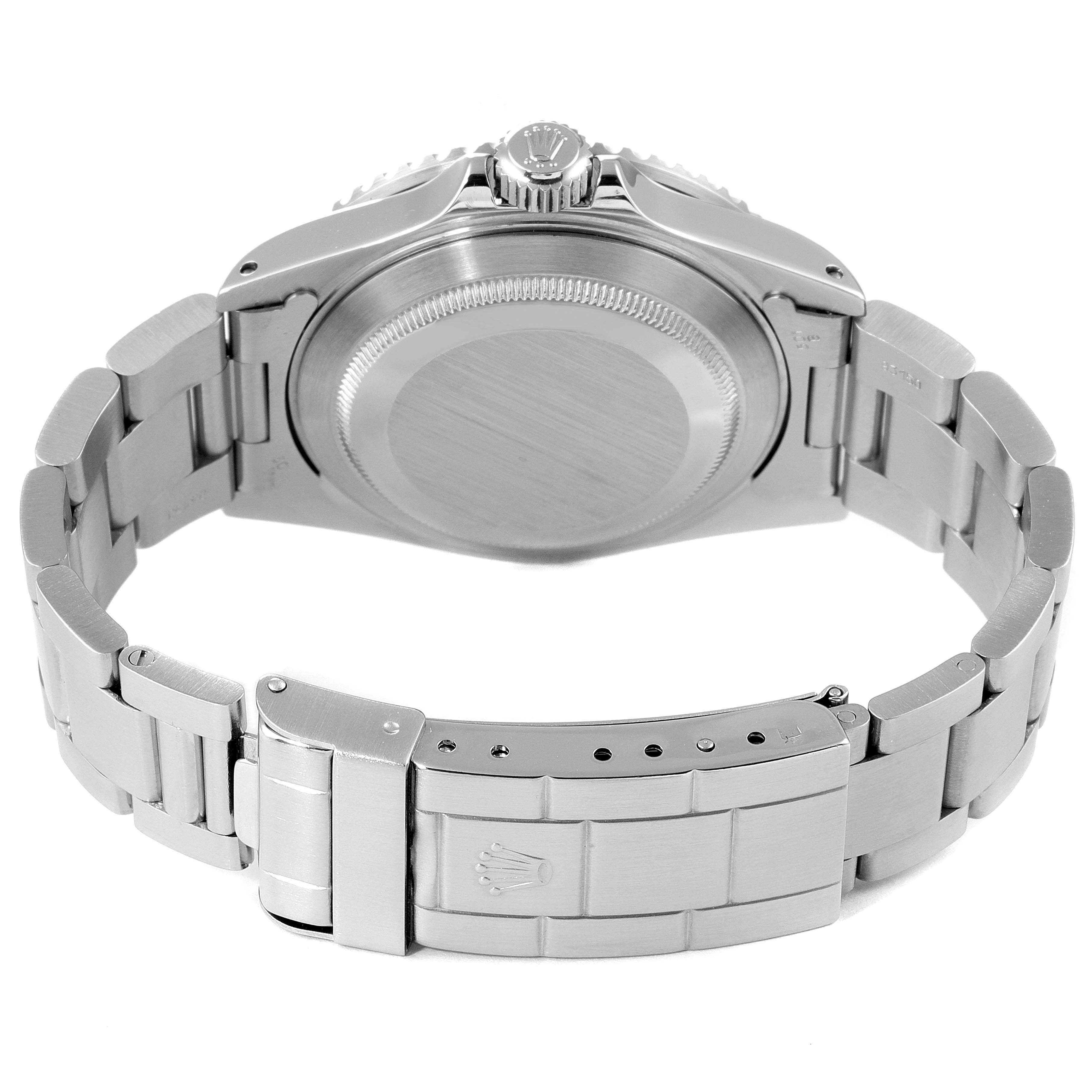 This image shows the back view of a Rolex Submariner 16610 Men's Stainless Steel Black Dial 16610 Men's Stainless Steel Black Dial watch, highlighting the case back and metal bracelet.