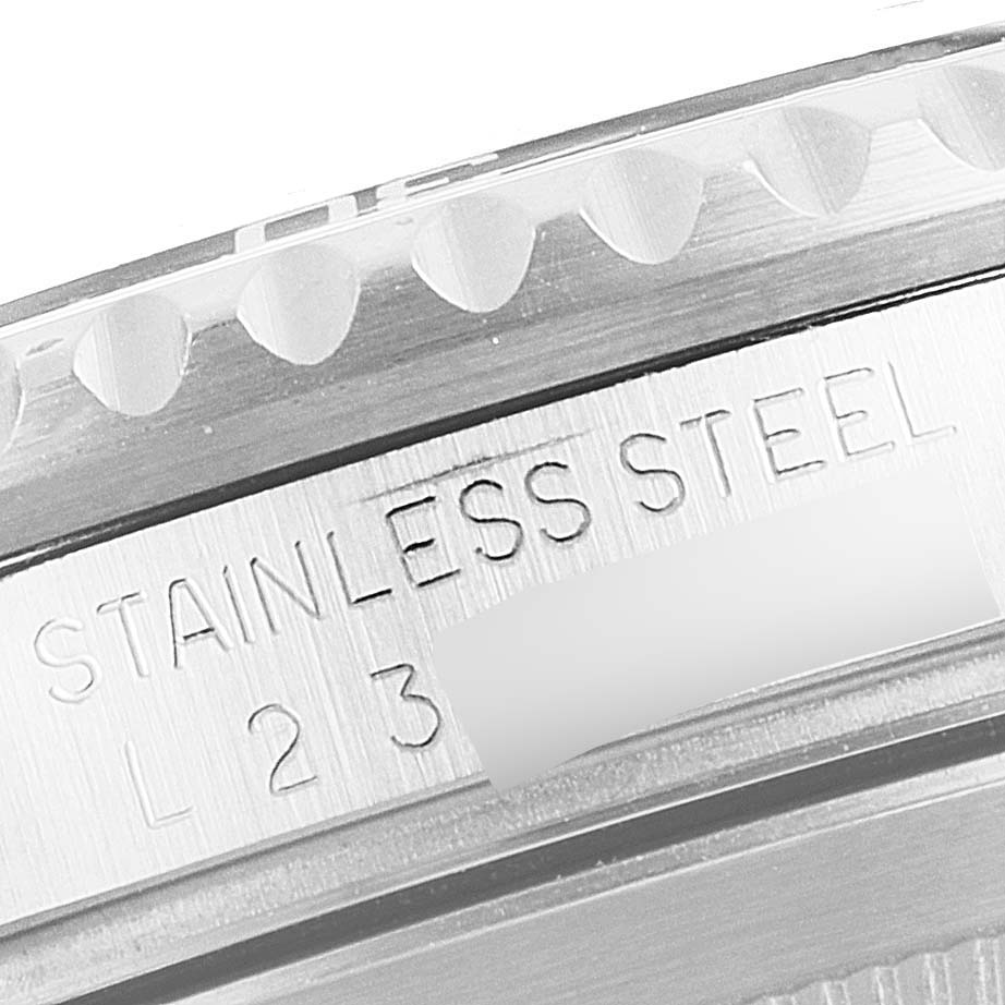 The image shows a close-up of the side detail and engraving on the stainless steel case of a Rolex Submariner 16610 Men's Stainless Steel Black Dial 16610 Men's Stainless Steel Black Dial watch.