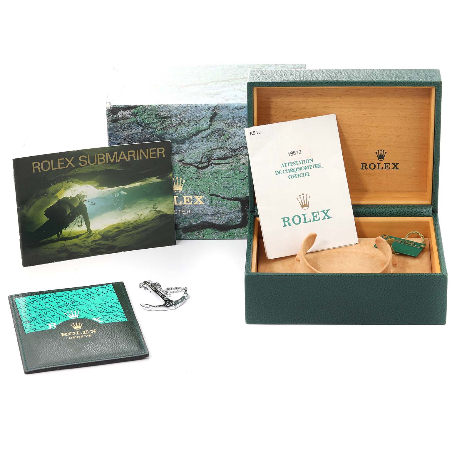 This image shows the box, manuals, tags, and accessories for a Rolex Submariner 16613 Men's Steel and Gold (two tone) Blue Dial 16613 Men's Steel and Gold (two tone) Blue Dial watch.