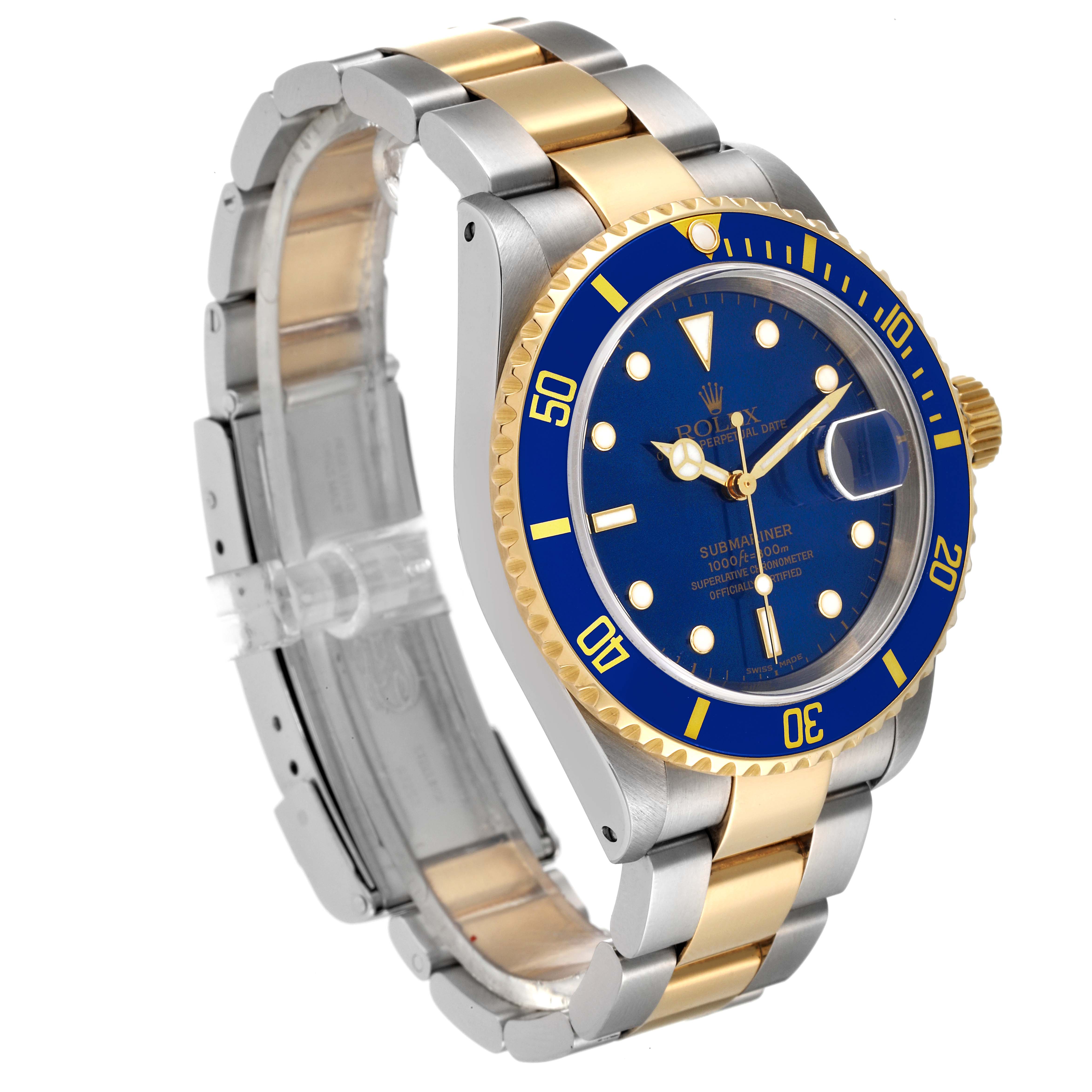 The image shows a Rolex Submariner 16613 Men's Steel and Gold (two tone) Blue Dial 16613 Men's Steel and Gold (two tone) Blue Dial watch from a three-quarter angle, highlighting its blue dial, bezel, and two-tone bracelet.