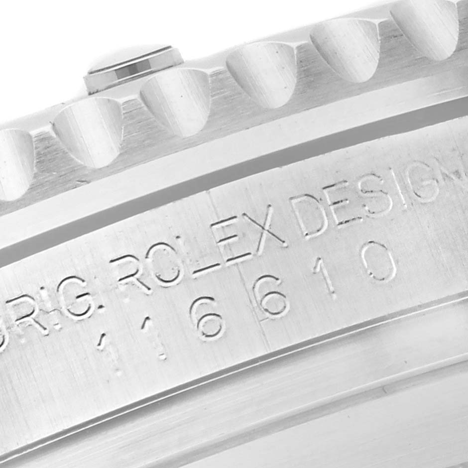 The image shows a close-up of the case side and edge of the bezel of a Rolex Submariner 116610 Men's Stainless Steel Black Dial 116610 Men's Stainless Steel Black Dial, highlighting engraved details.