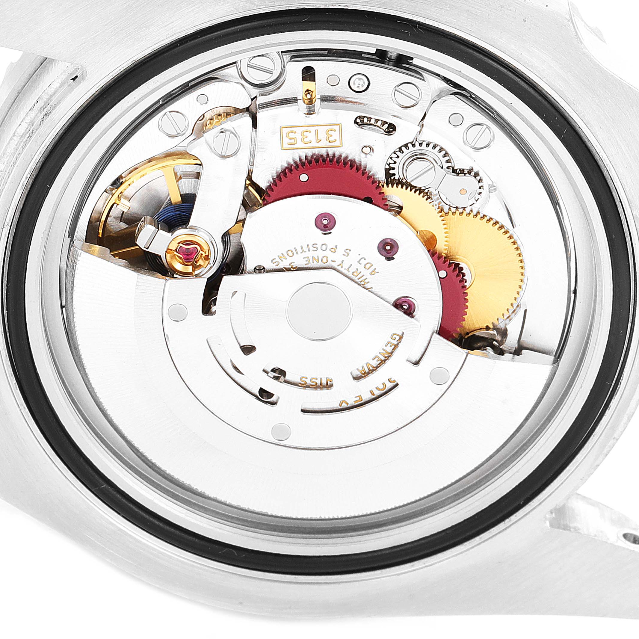 The image shows the inner mechanics and movement assembly of a Rolex Submariner 116610LV Men
s Stainless Steel Green Dial 116610LV Men
s Stainless Steel Green Dial watch viewed from the back.