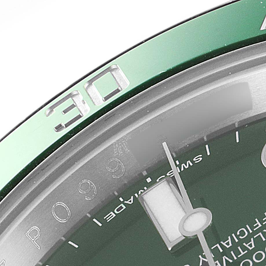 This image shows a close-up of the bezel and part of the dial of a Rolex Submariner 116610LV Men
s Stainless Steel Green Dial 116610LV Men
s Stainless Steel Green Dial watch.