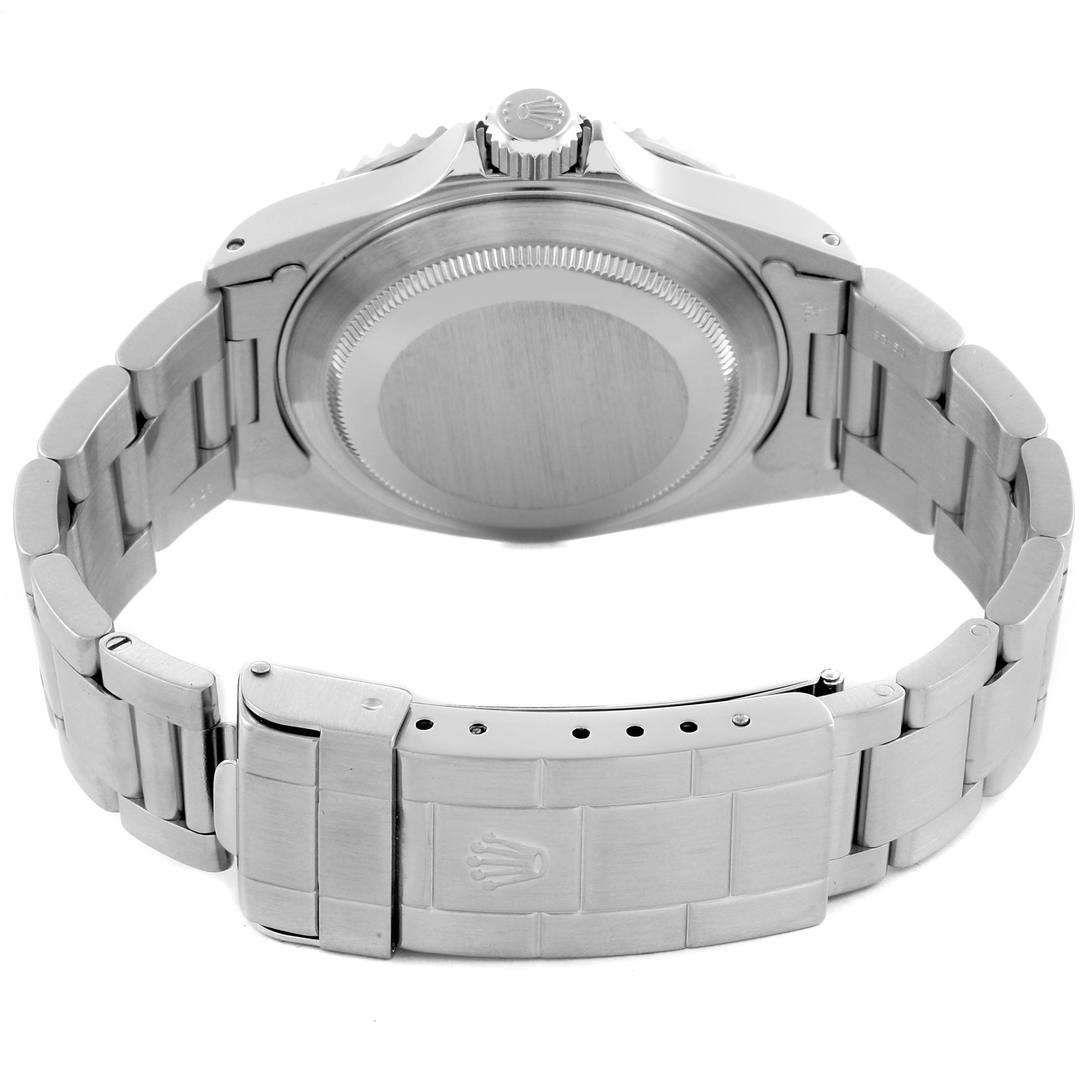 The image shows the back view of a Rolex Submariner 14060 Men
s Stainless Steel Black Dial 14060 Men
s Stainless Steel Black Dial, featuring its case, crown, and bracelet.