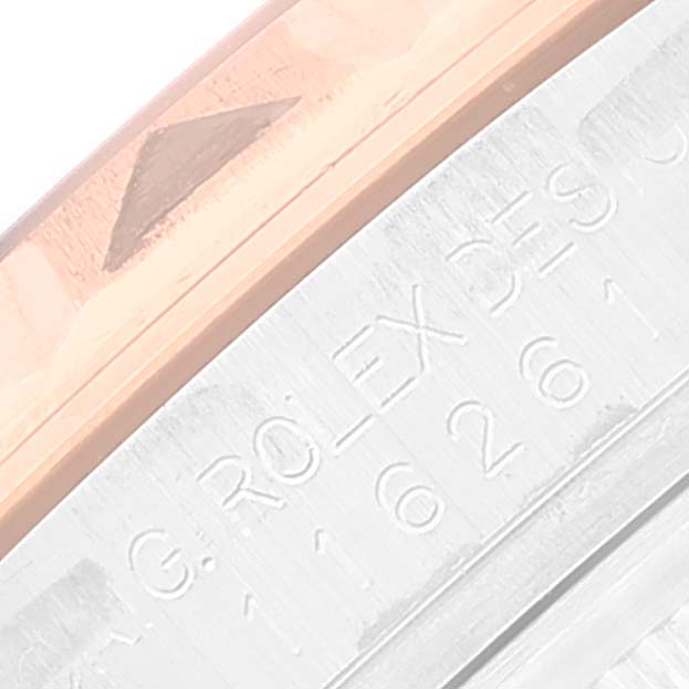 The image shows an extreme close-up of the bezel and part of the engraved text on the side of the Rolex Turn-o-Graph 116261 Men's Steel and Gold (two tone) Silver Dial 116261 Men's Steel and Gold (two tone) Silver Dial watch.