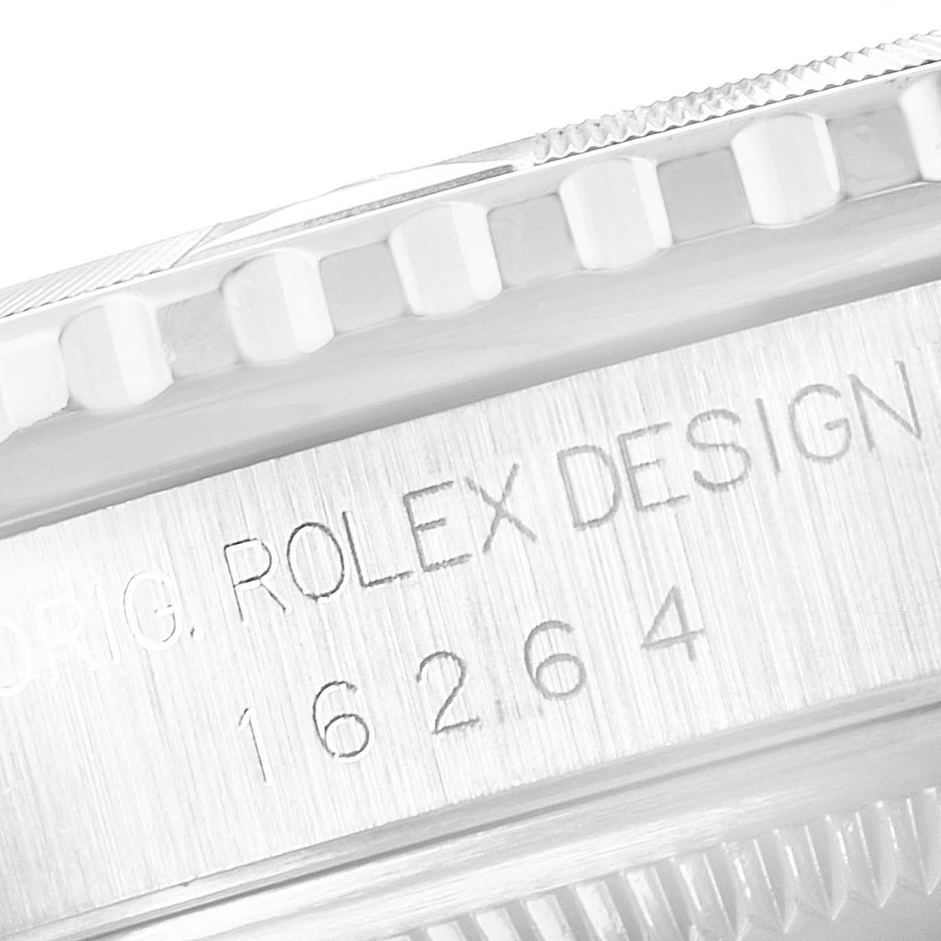 This close-up image shows the engraving and knurled bezel edge of a Rolex Turn-o-Graph 16264 Men's Stainless Steel White Dial 16264 Men's Stainless Steel White Dial model 16264 watch.