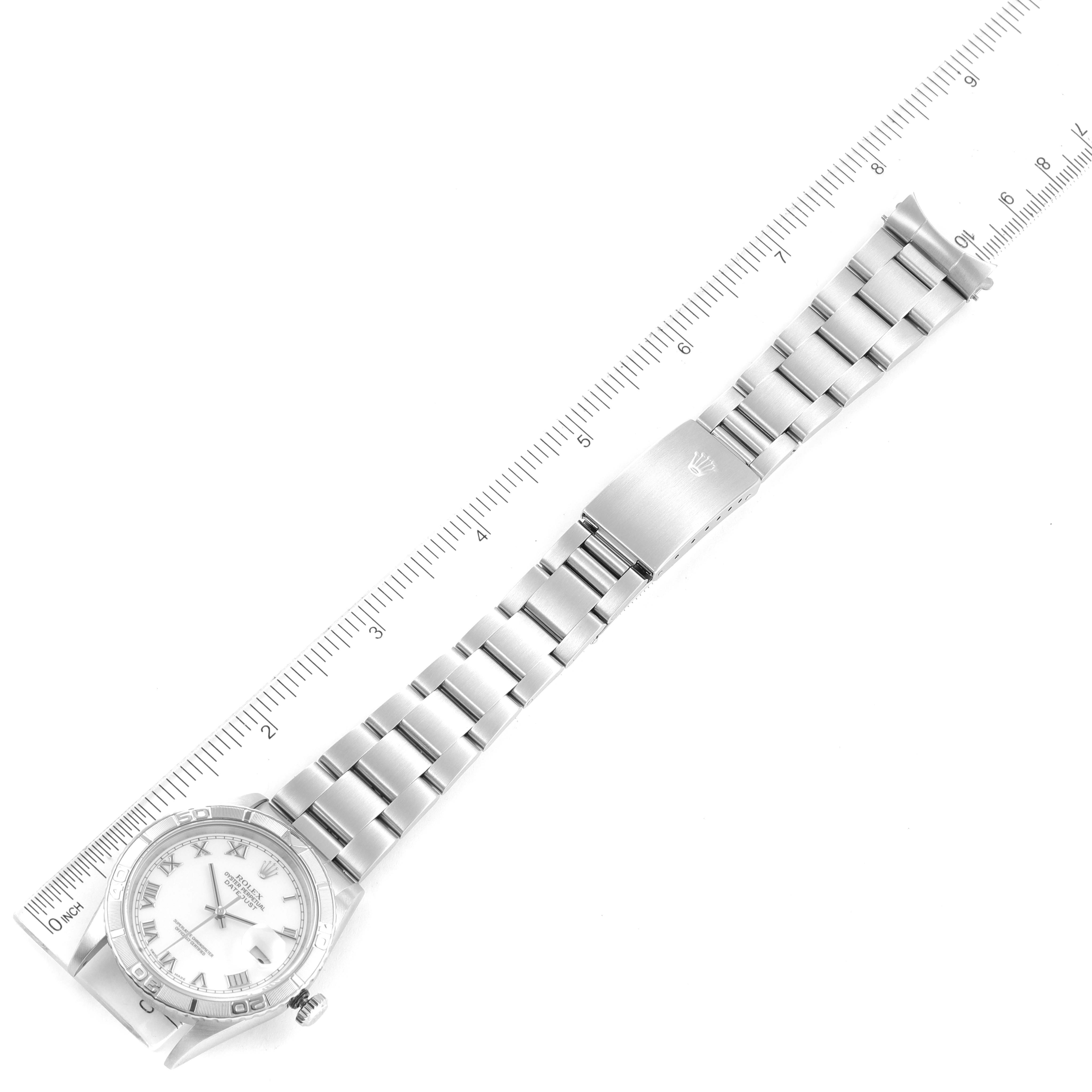 The image shows a top-down view of a Rolex Turn-o-Graph 16264 Men's Stainless Steel White Dial 16264 Men's Stainless Steel White Dial watch, highlighting its bracelet and clasp alongside a ruler for measurement.