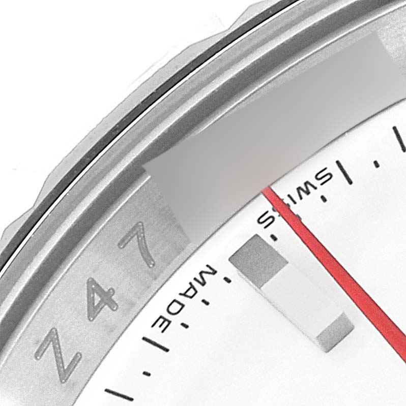 This close-up image of the Rolex Turn-o-Graph 116264 Men's Stainless Steel White Dial 116264 Men's Stainless Steel White Dial watch shows a partial view of the dial, markers, and the bezel.