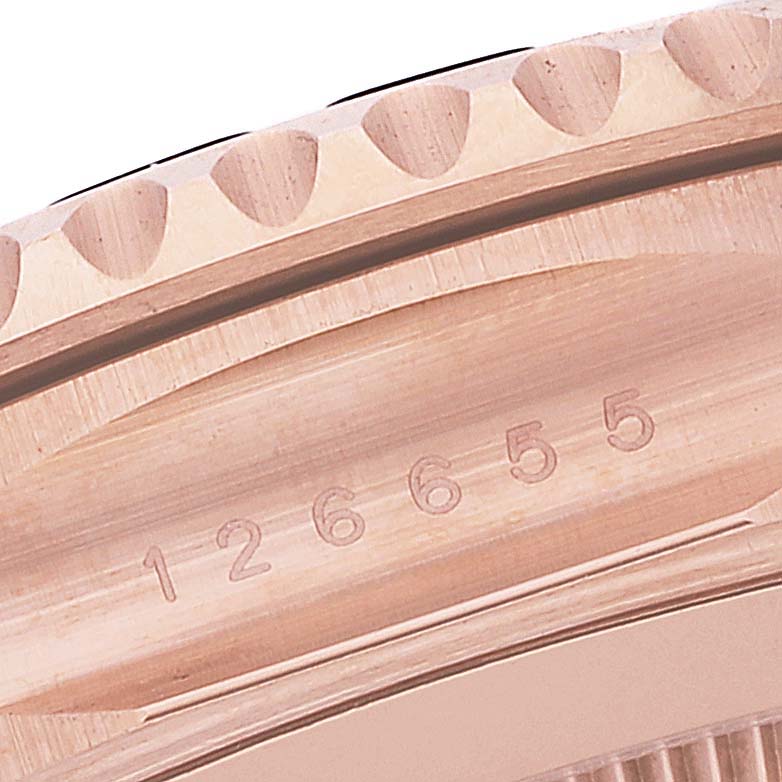 This image shows a close-up of the bezel and serial number engraving on a Rolex Yacht-Master 126655 Men's Rose Gold Black Dial 126655 Men's Rose Gold Black Dial watch.