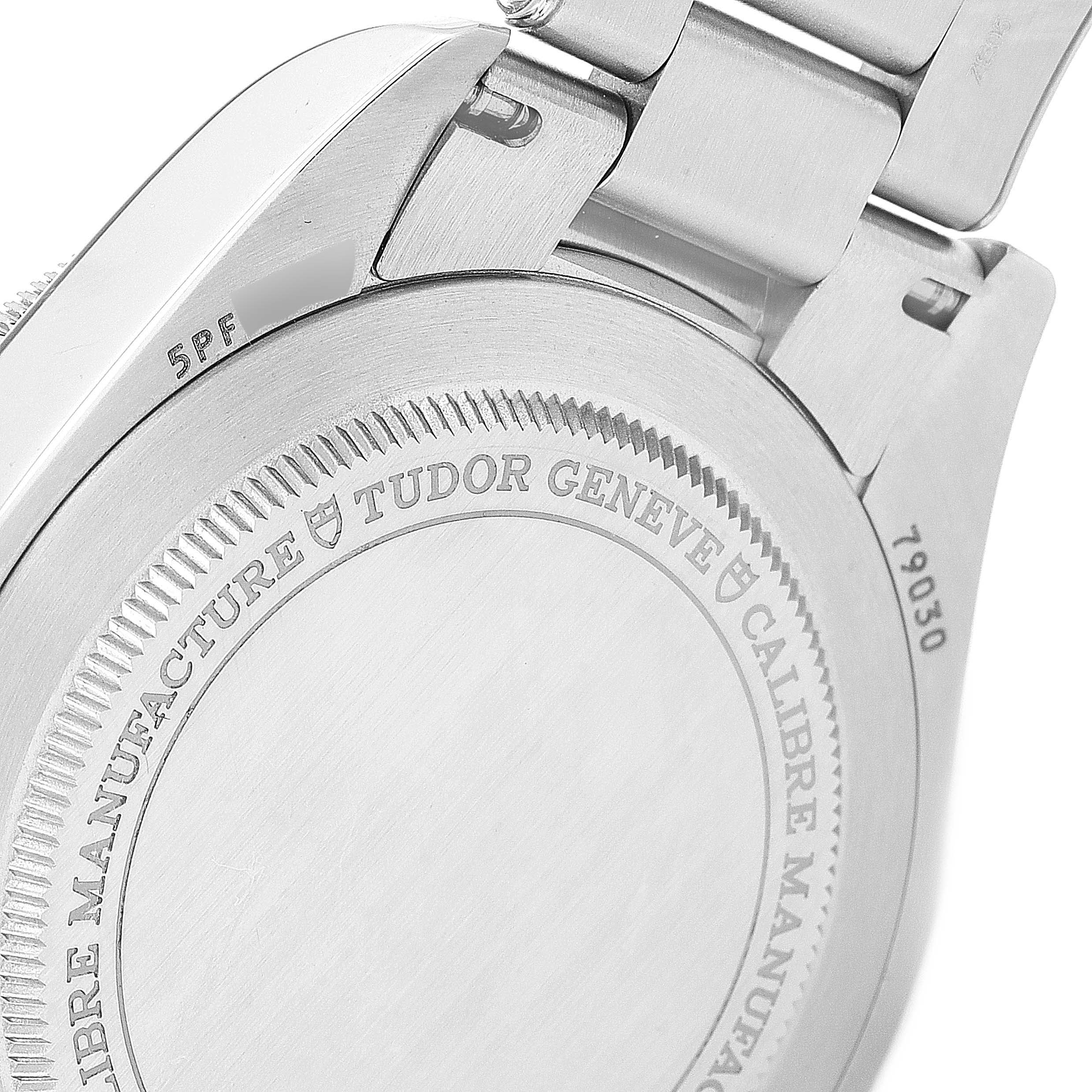 This image shows the back case of the Tudor Heritage Black Bay 79030B Men's Stainless Steel Blue Dial 79030B Men's Stainless Steel Blue Dial watch, highlighting the engraving and the metal bracelet.