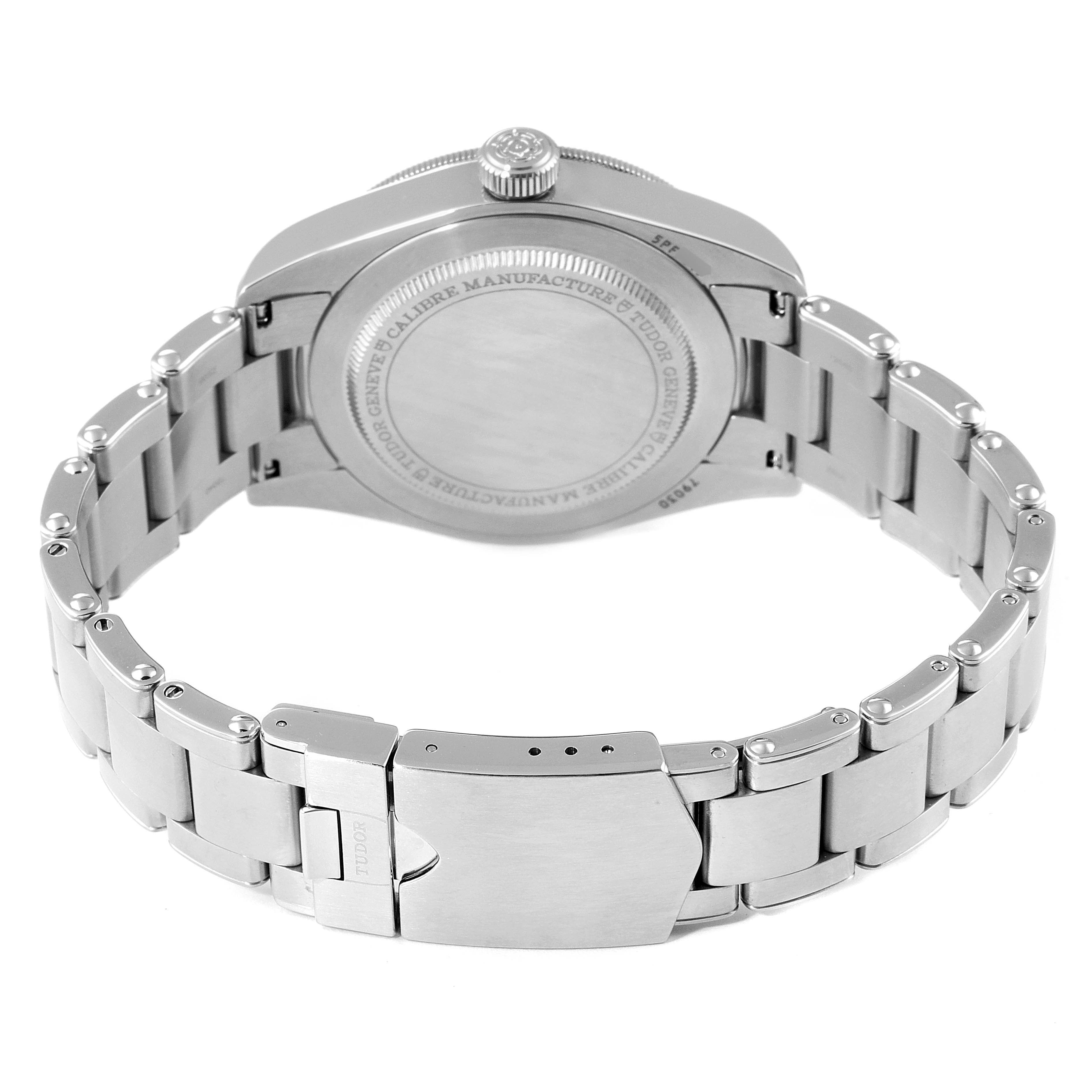 The image shows the back view of the Tudor Heritage Black Bay 79030B Men's Stainless Steel Blue Dial 79030B Men's Stainless Steel Blue Dial watch, highlighting the case back, crown, and metal bracelet with clasp.