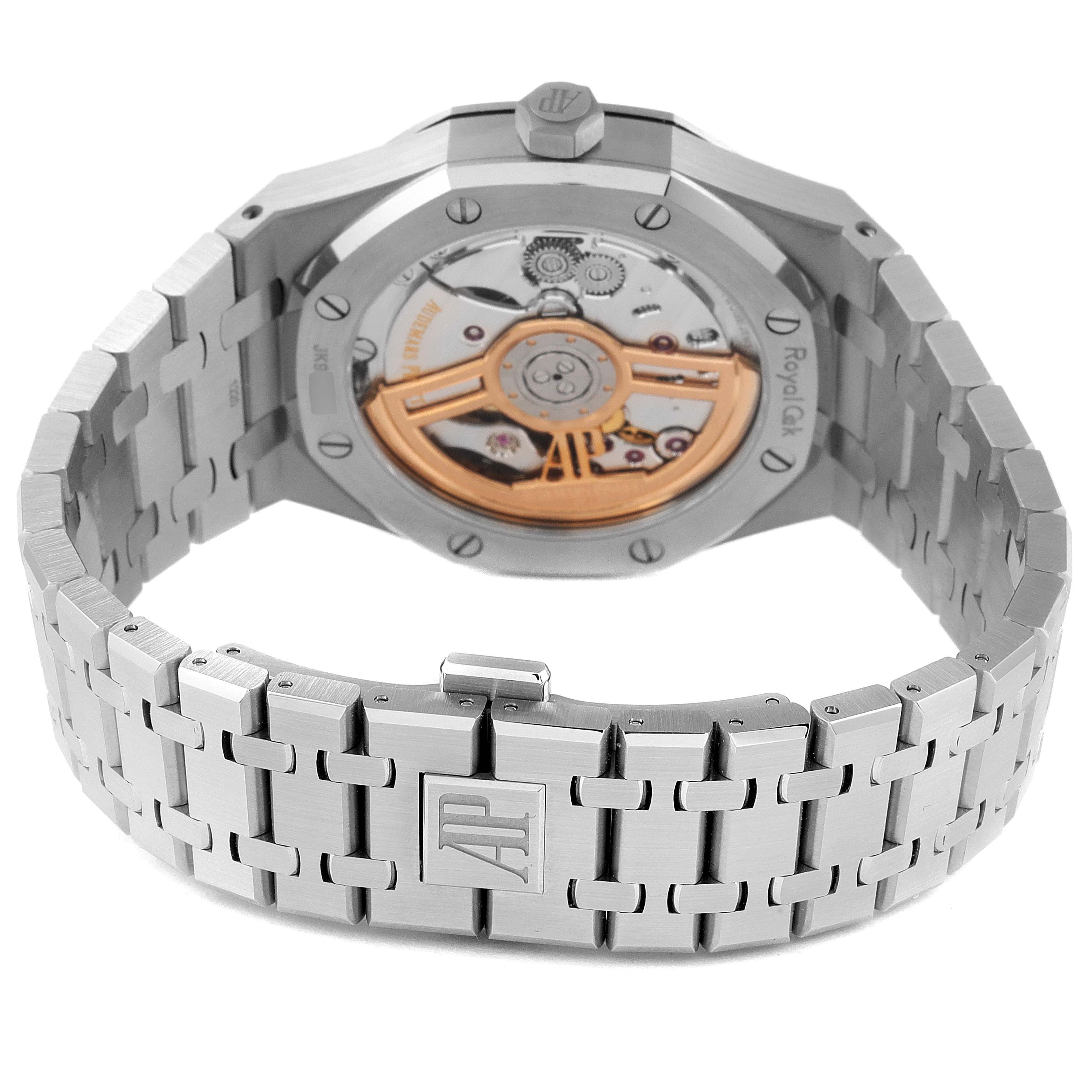 The image shows the back case and bracelet of an Audemars Piguet Royal Oak 15500ST.OO.1220ST.04 Men's Stainless Steel Silver Dial 15500ST.OO.1220ST.04 Men's Stainless Steel Silver Dial watch, highlighting its open case back and intricate linkage.