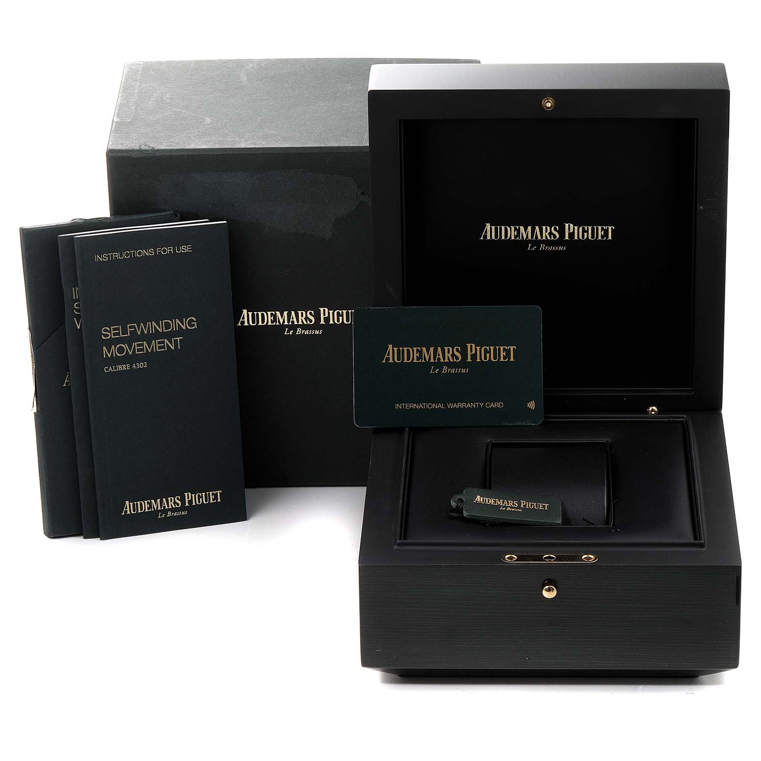 The image shows the box, warranty card, and manuals for the Audemars Piguet Royal Oak 15500ST.OO.1220ST.04 Men's Stainless Steel Silver Dial 15500ST.OO.1220ST.04 Men's Stainless Steel Silver Dial watch.