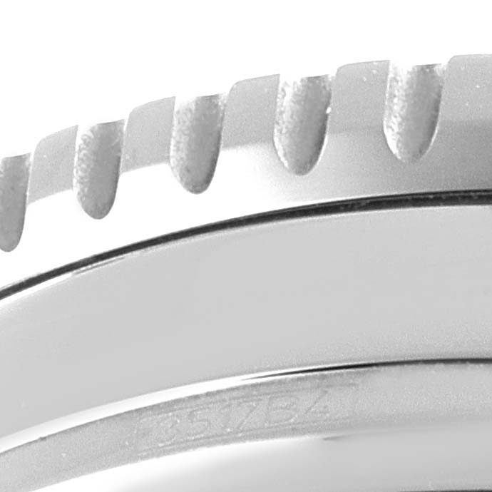This close-up image shows the textured bezel and part of the case of a Breitling Navitimer A13324 Men's Stainless Steel Blue Dial A13324 Men's Stainless Steel Blue Dial watch.