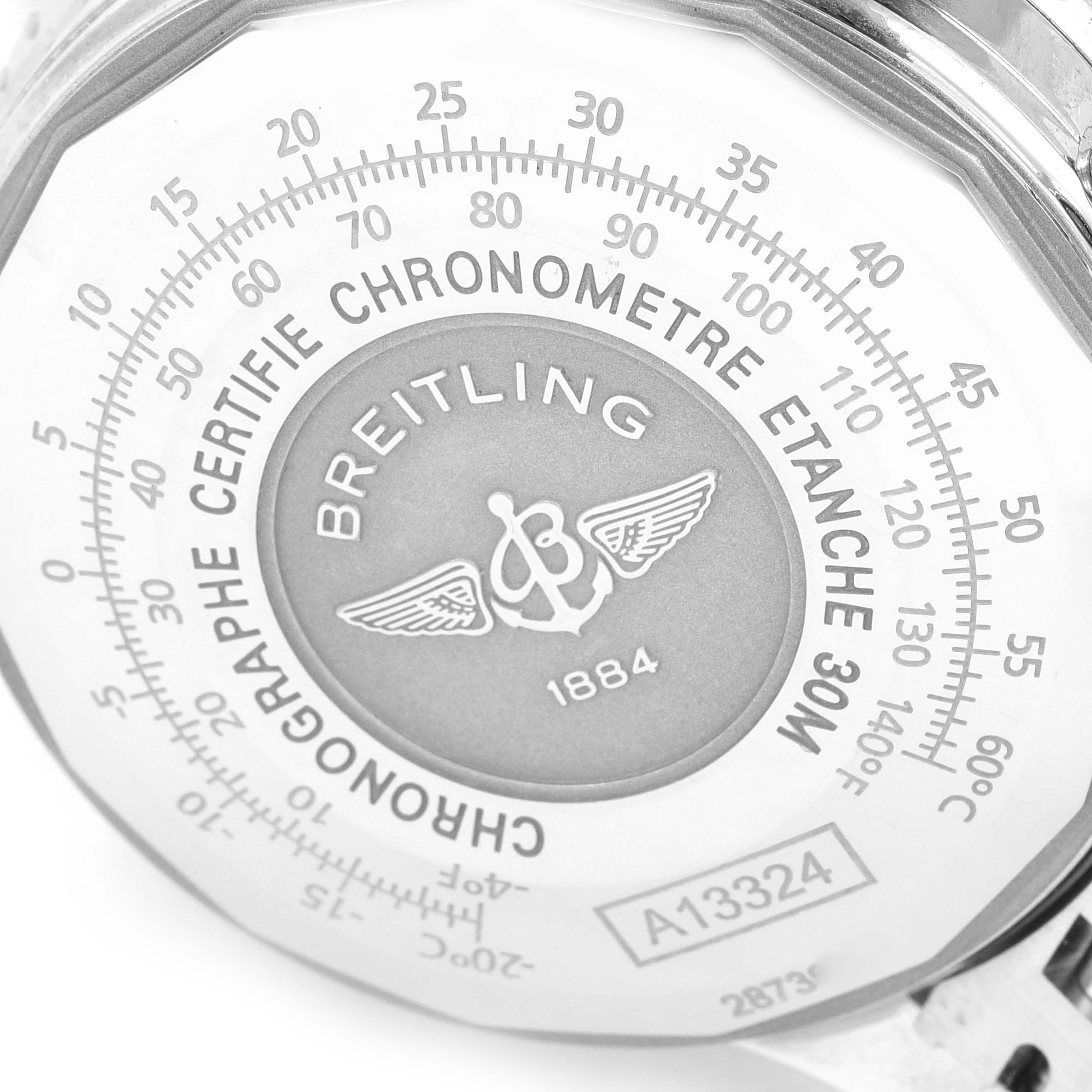 The image shows the back case of a Breitling Navitimer A13324 Men's Stainless Steel Blue Dial A13324 Men's Stainless Steel Blue Dial watch, highlighting the brand logo and certification markings.