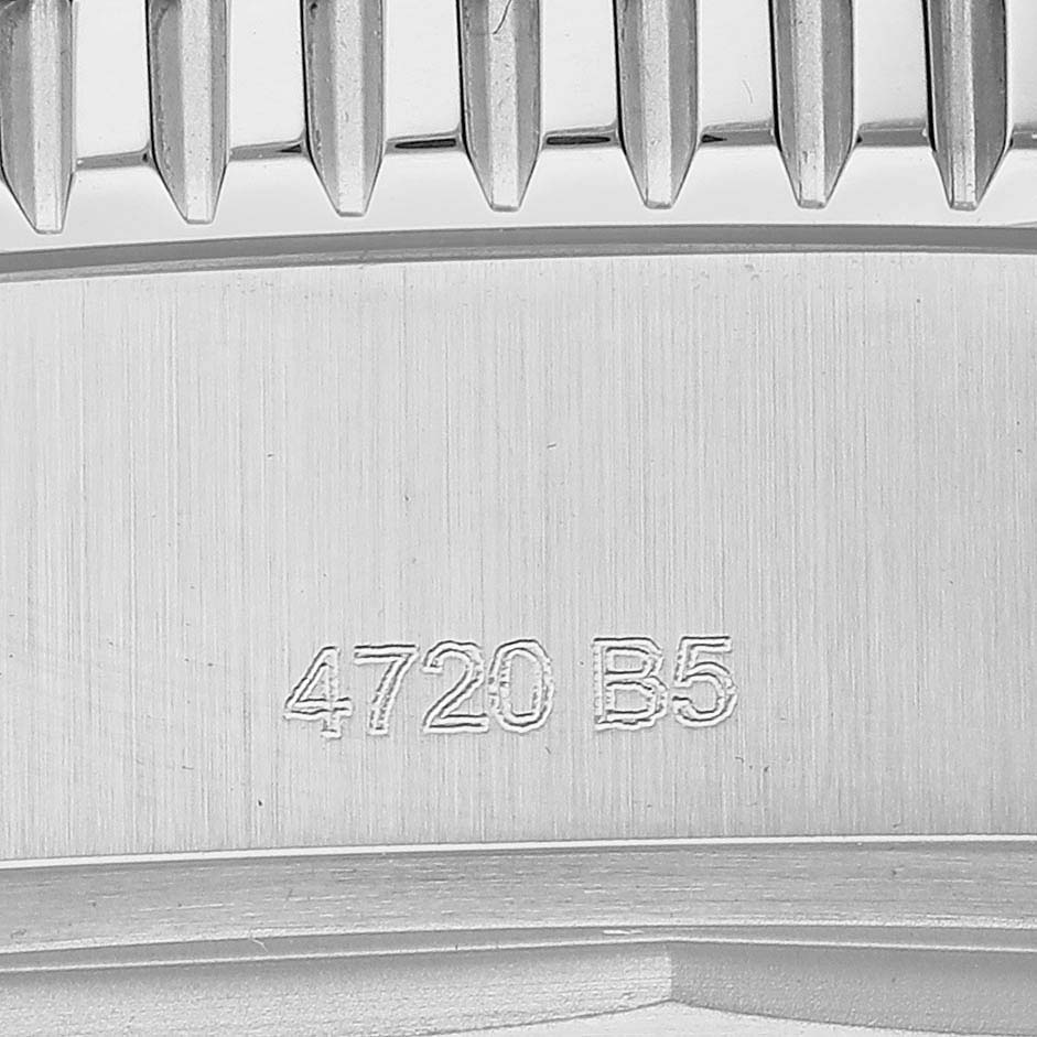 This image shows a close-up of the back side of the bezel on a Breitling Superocean A17367 Men
s Stainless Steel Blue Dial A17367 Men
s Stainless Steel Blue Dial watch, including part 4720 B5.