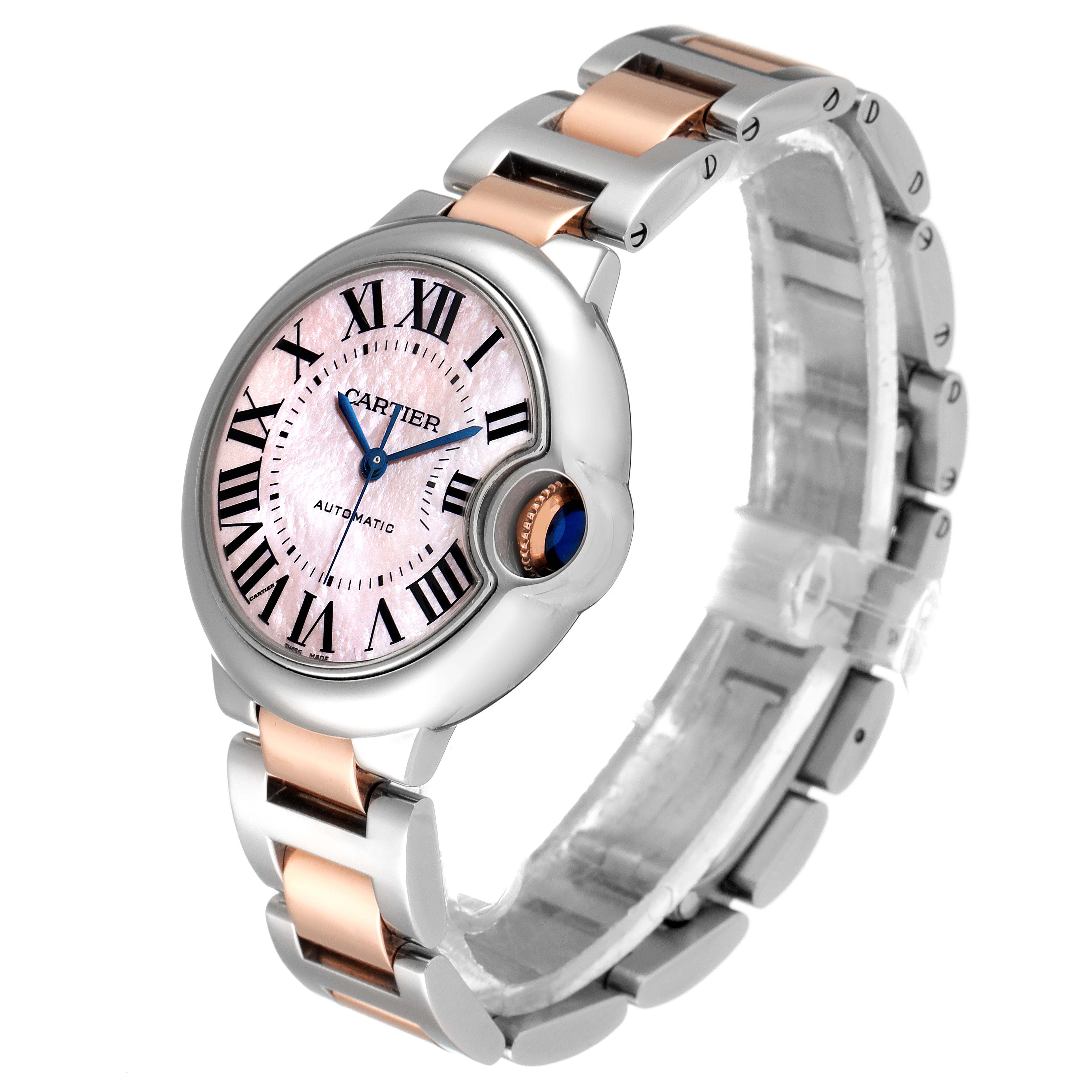 The image shows a Cartier Ballon Bleu W6920098 Women's Steel and Gold (two tone) Mother of Pearl Dial W6920098 Women's Steel and Gold (two tone) Mother of Pearl Dial watch at a 3/4 angle, highlighting the face, crown, and two-tone bracelet.
