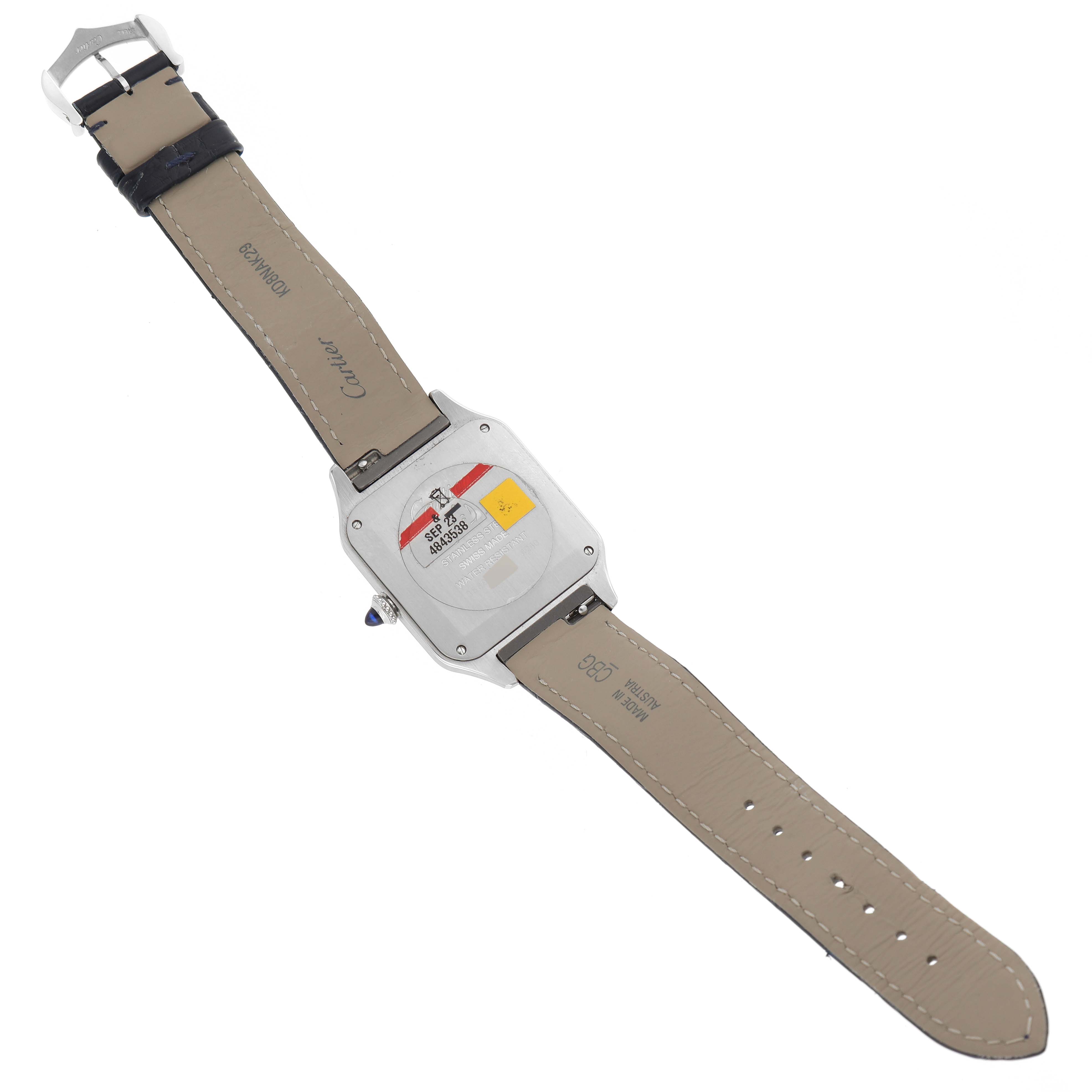 The image shows the back view of the Cartier Santos Dumont WSSA0022 Men
s Stainless Steel Silver Dial WSSA0022 Men
s Stainless Steel Silver Dial watch, highlighting the case back and leather strap.