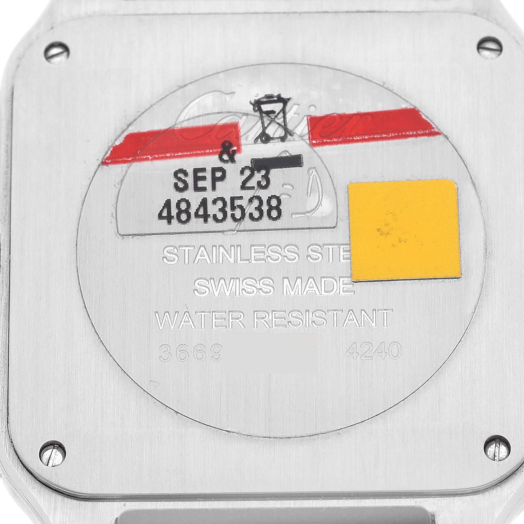 This image shows the back case of a Cartier Santos Dumont WSSA0022 Men
s Stainless Steel Silver Dial WSSA0022 Men
s Stainless Steel Silver Dial watch, highlighting its stainless steel material and water resistance.