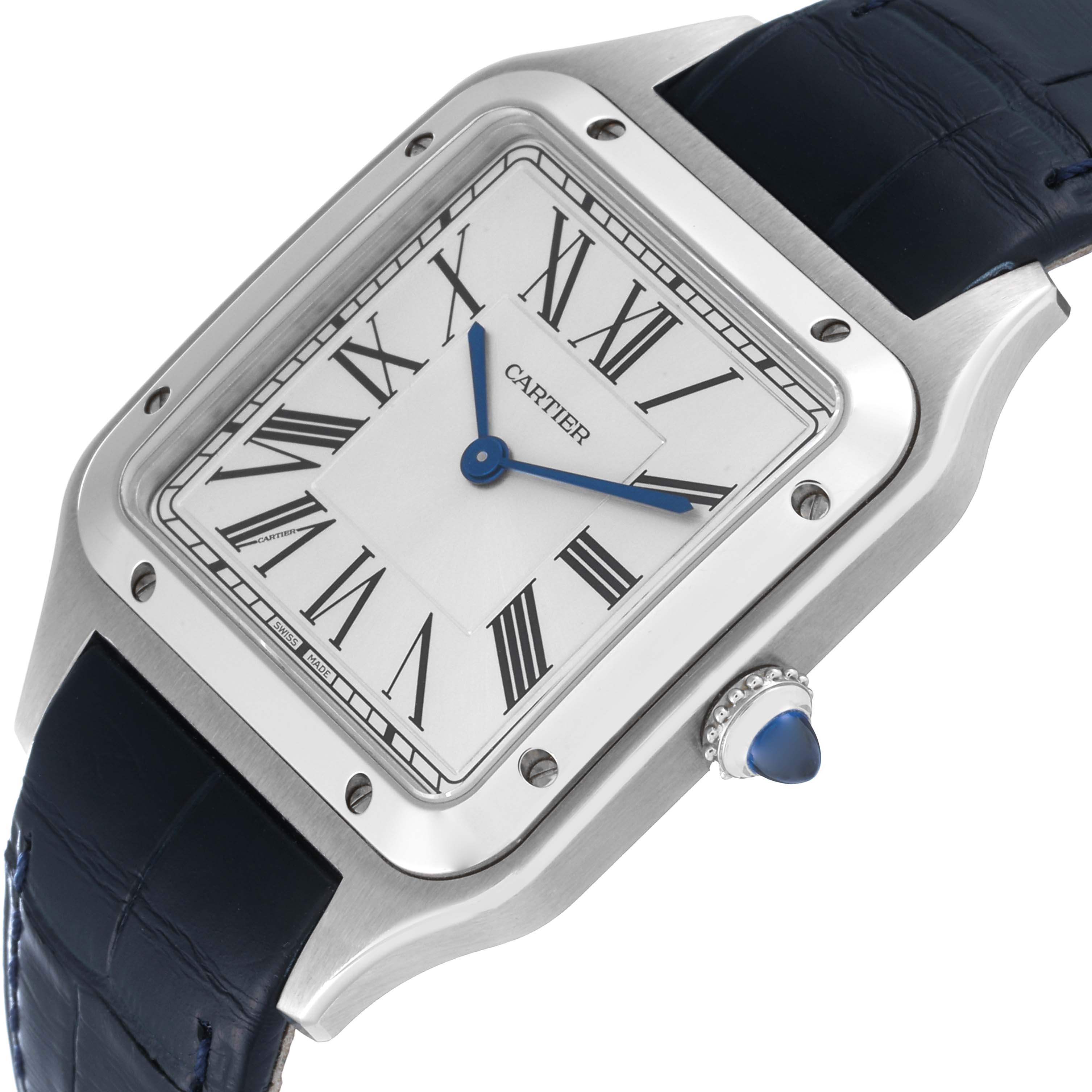 The image shows the front and right side of a Cartier Santos Dumont WSSA0022 Men
s Stainless Steel Silver Dial WSSA0022 Men
s Stainless Steel Silver Dial watch, highlighting the dial, crown, and part of the strap.